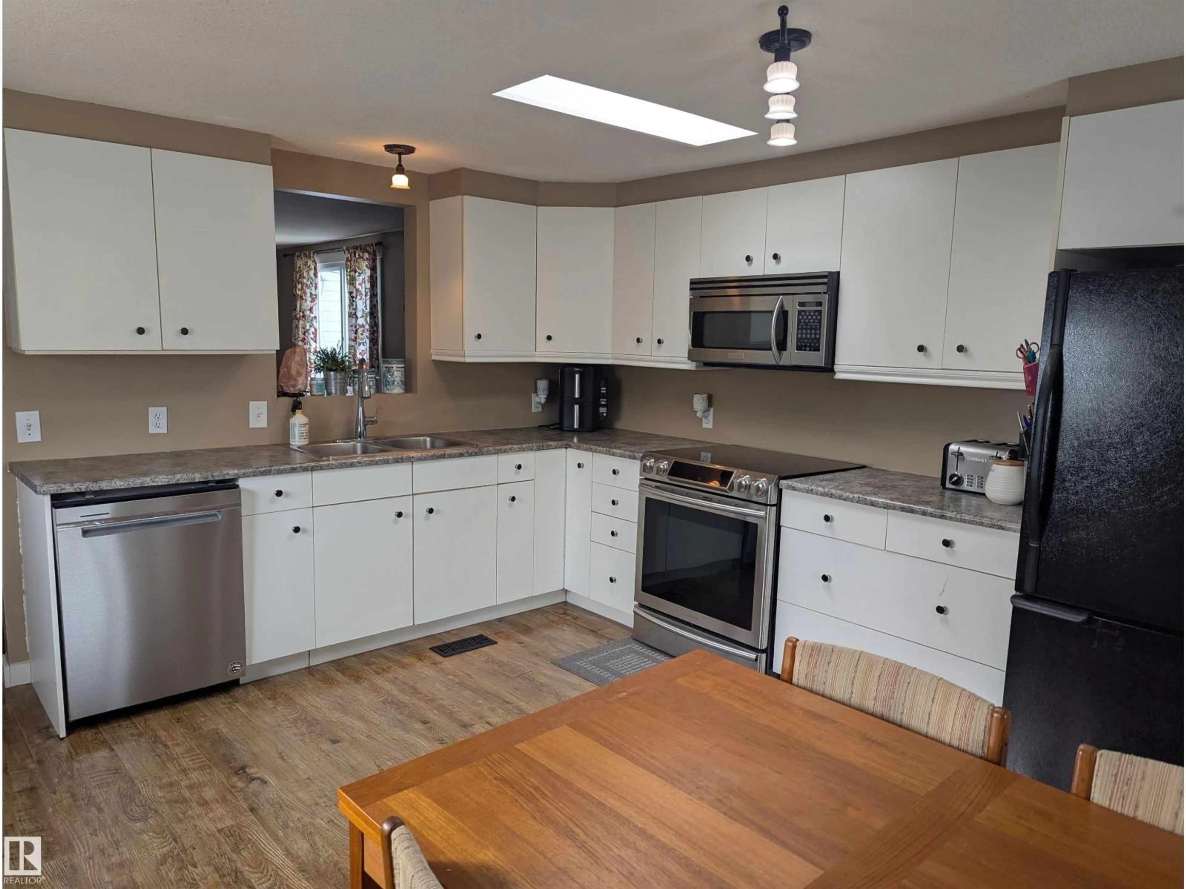 Open concept kitchen, wood/laminate floor for 50312 RANGE ROAD 200, Rural Beaver County Alberta T0B4J2