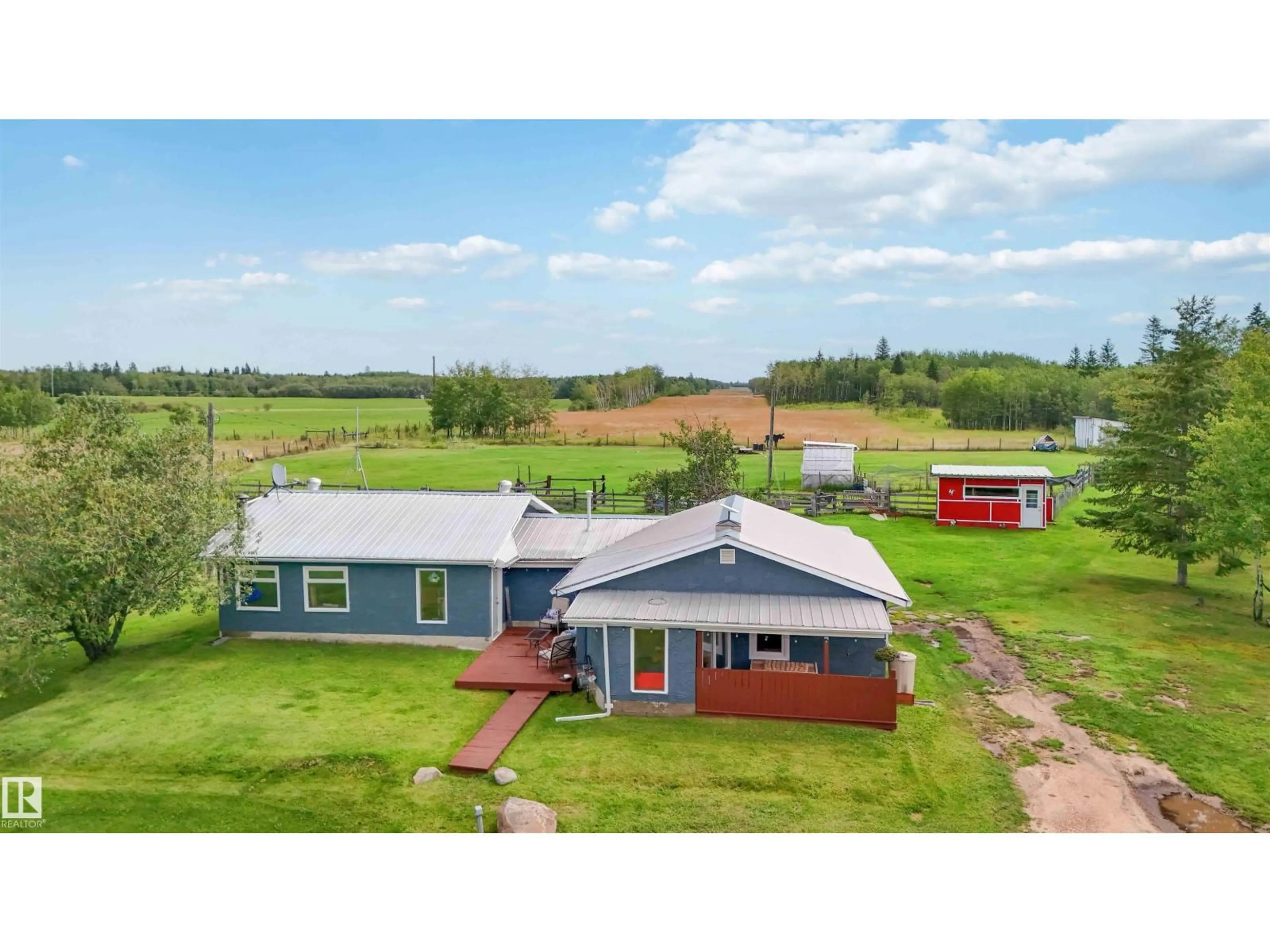 A pic from outside/outdoor area/front of a property/back of a property/a pic from drone, building for 19 - 23422 TWP RD 582, Rural Sturgeon County Alberta T0G1L2