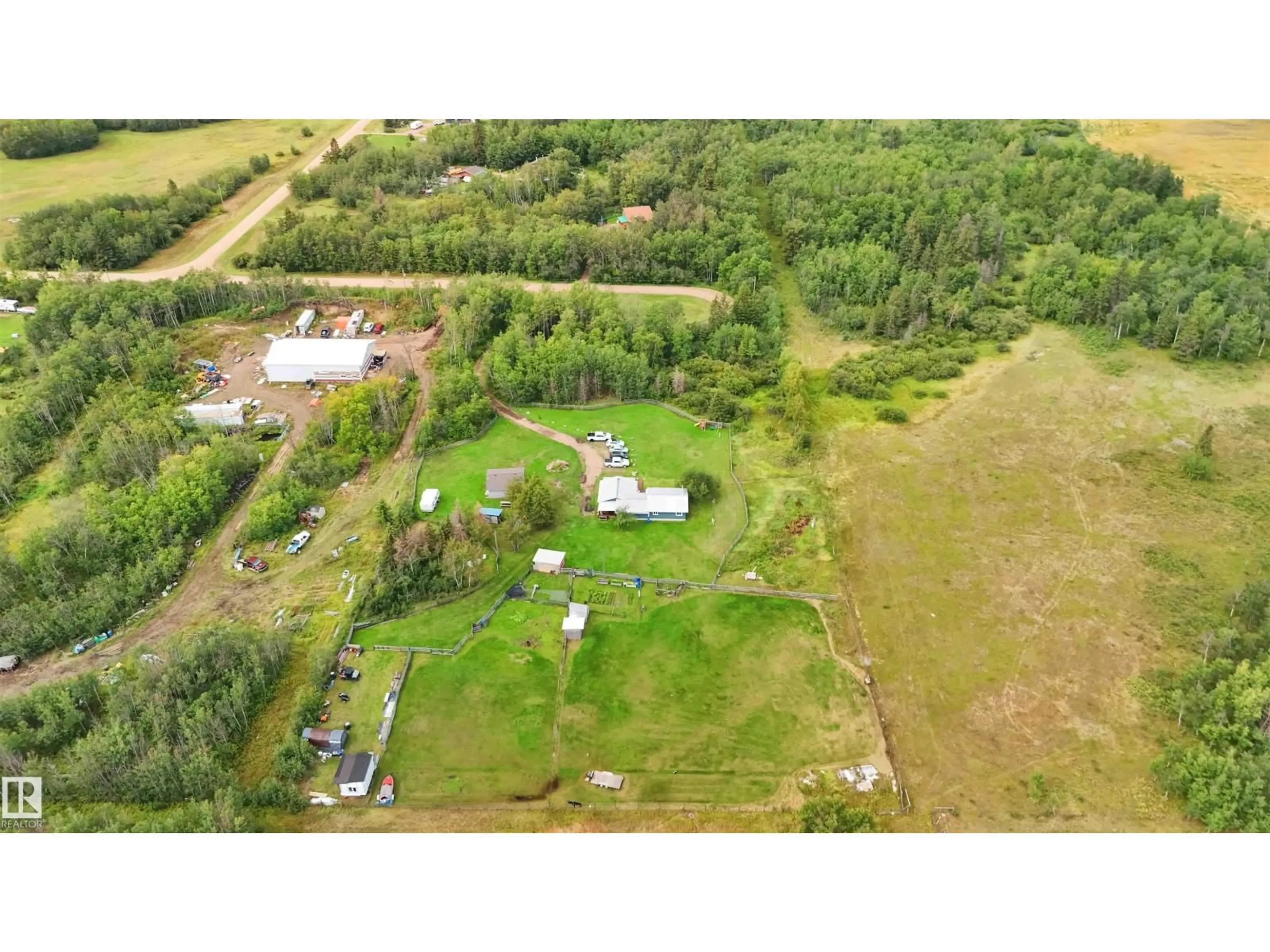 A pic from outside/outdoor area/front of a property/back of a property/a pic from drone, unknown for 19 - 23422 TWP RD 582, Rural Sturgeon County Alberta T0G1L2