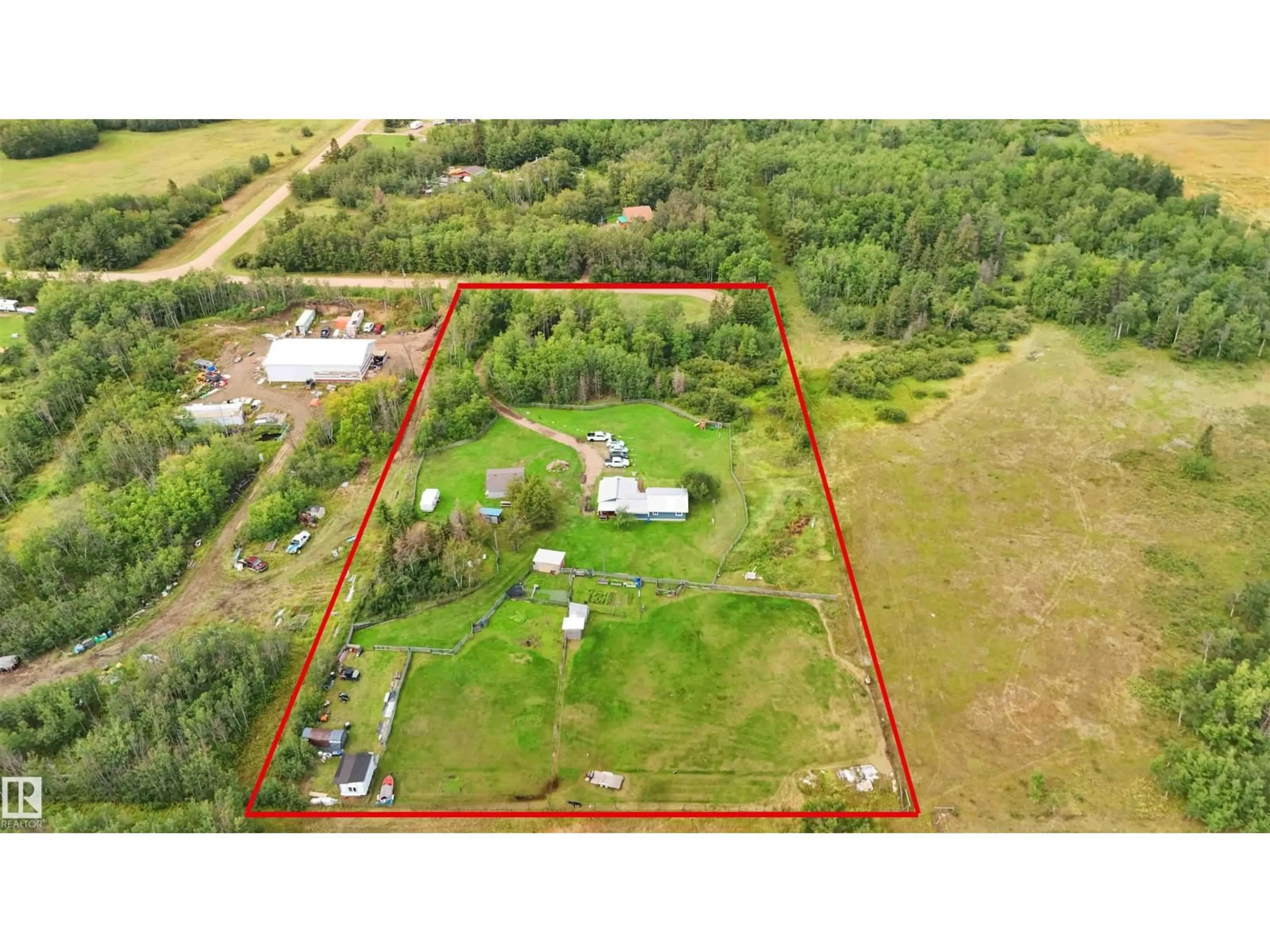 A pic from outside/outdoor area/front of a property/back of a property/a pic from drone, building for 19 - 23422 TWP RD 582, Rural Sturgeon County Alberta T0G1L2