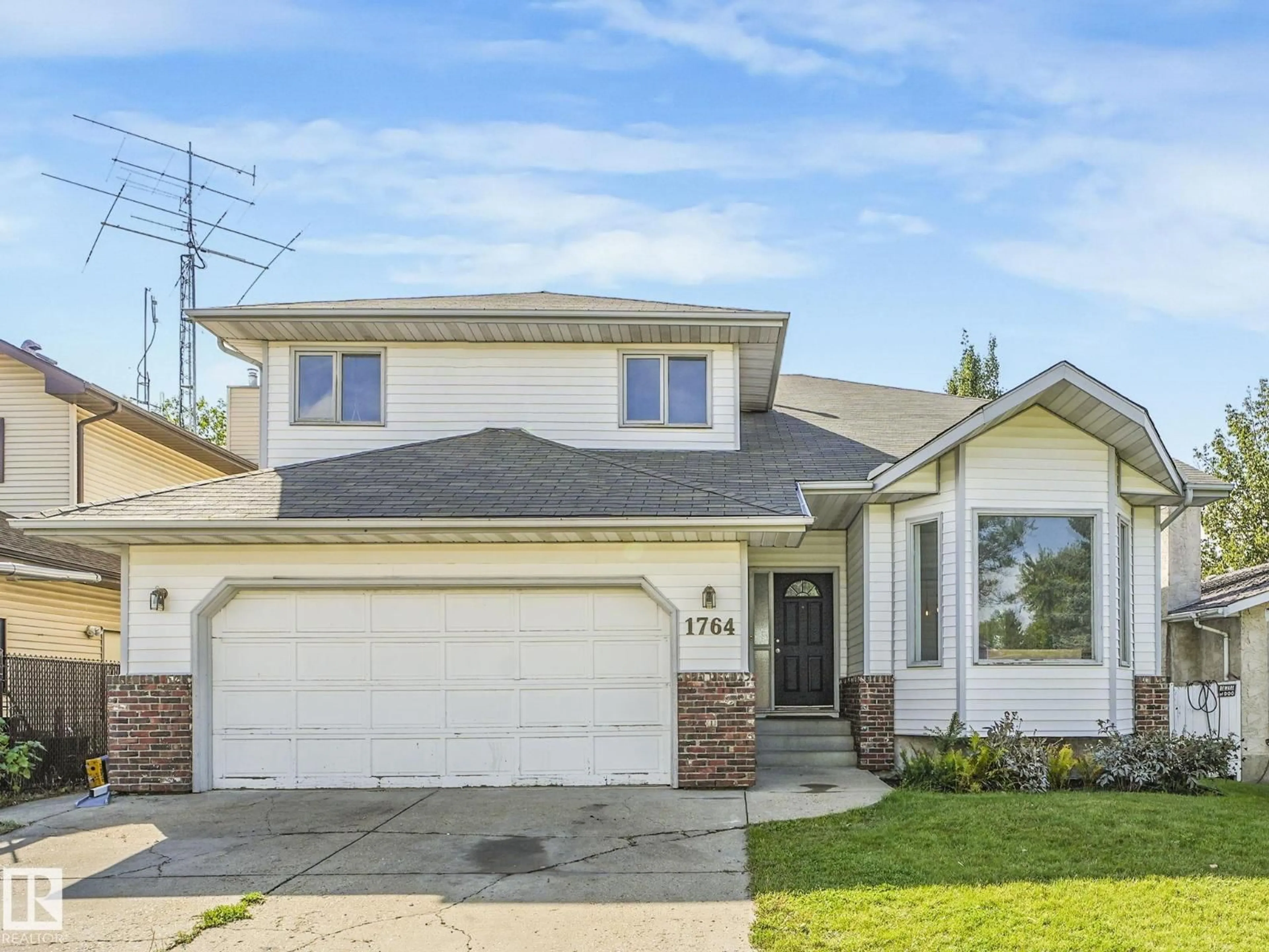 Home with vinyl exterior material, street for NW - 1764 49A ST, Edmonton Alberta T6L3K6