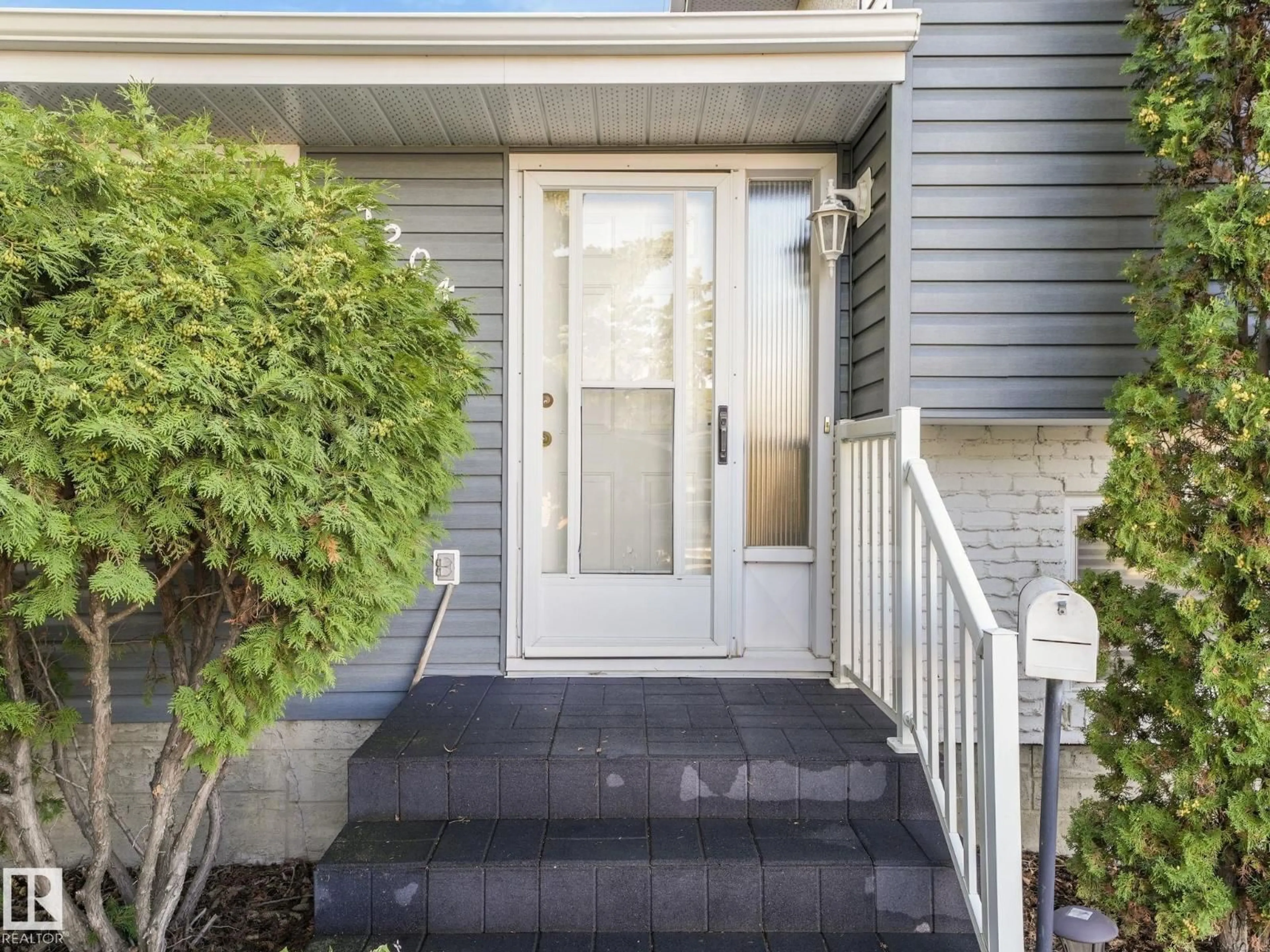 Home with vinyl exterior material, street for NW - 4204 117 ST, Edmonton Alberta T6J1T7