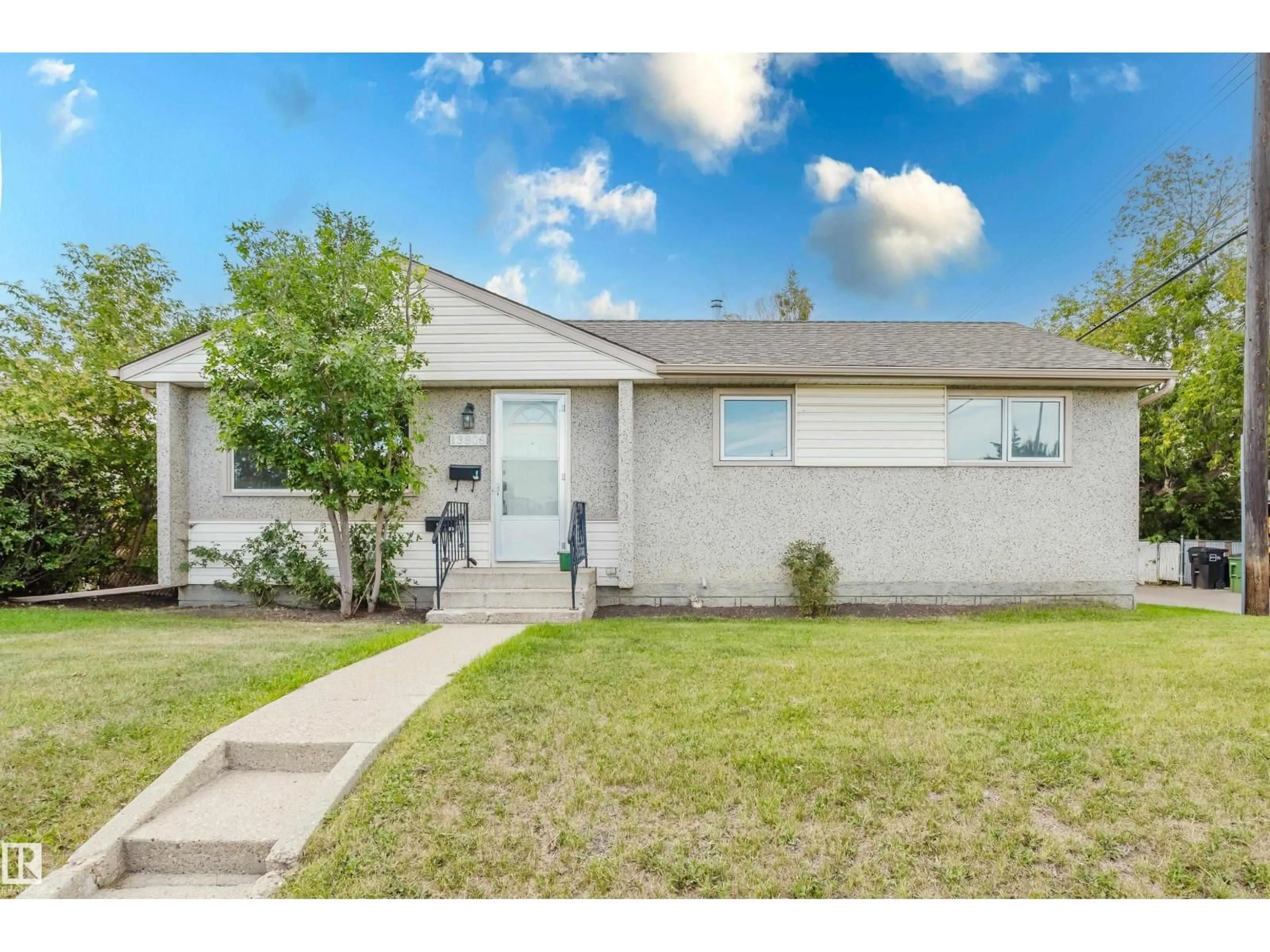 Home with vinyl exterior material, street for 13808 135 AV NW, Edmonton Alberta T5L3Y8
