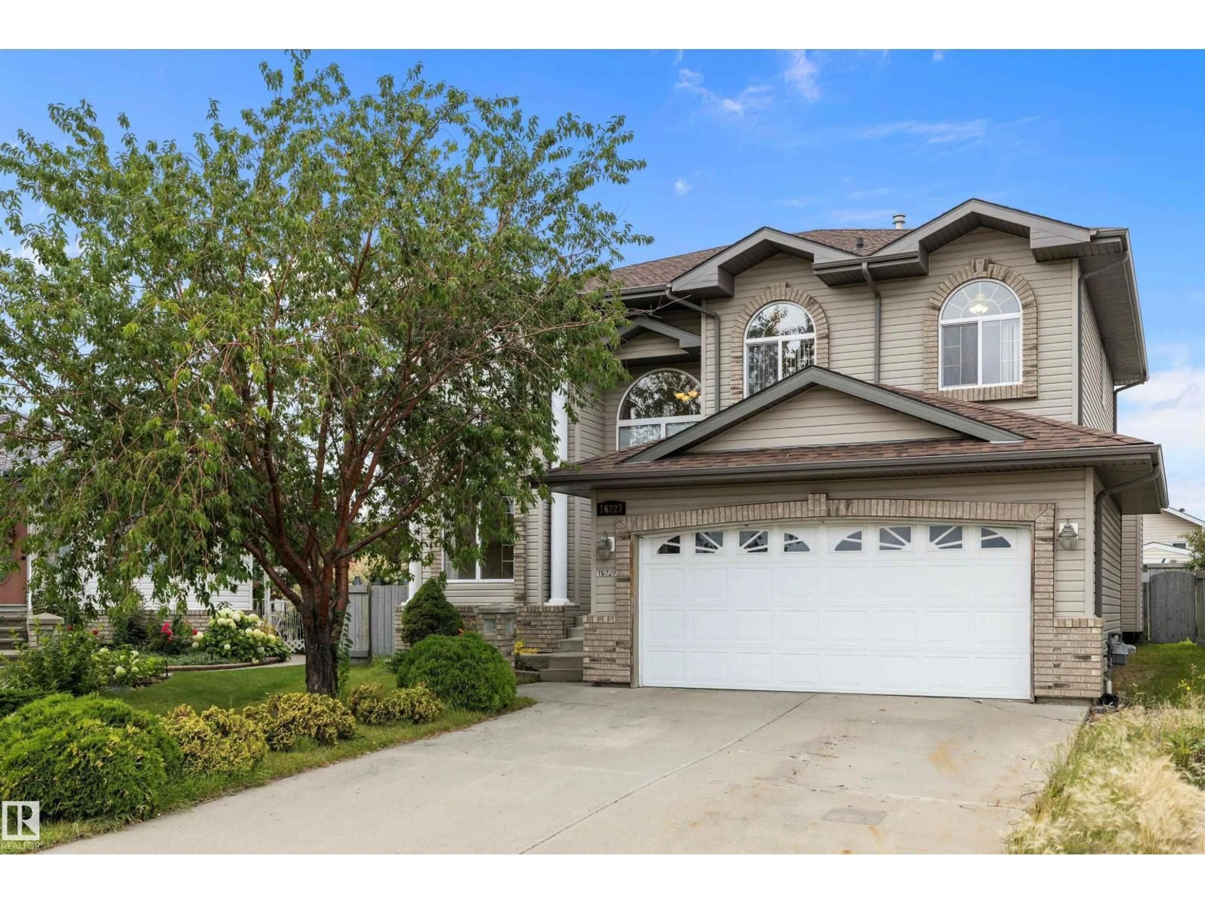 Home with vinyl exterior material, street for NW - 16227 84 ST, Edmonton Alberta T5Z3N8