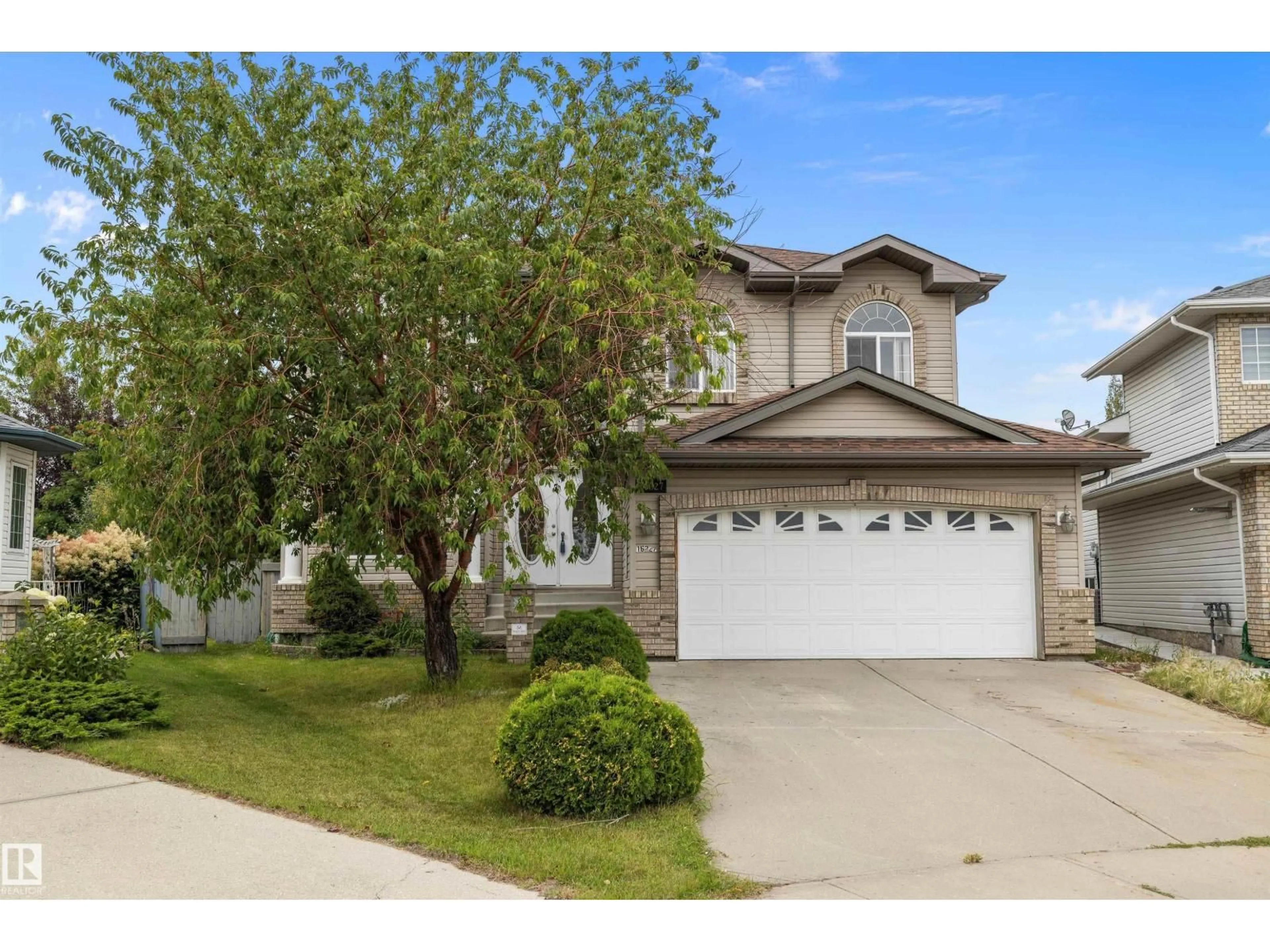 Home with vinyl exterior material, street for NW - 16227 84 ST, Edmonton Alberta T5Z3N8