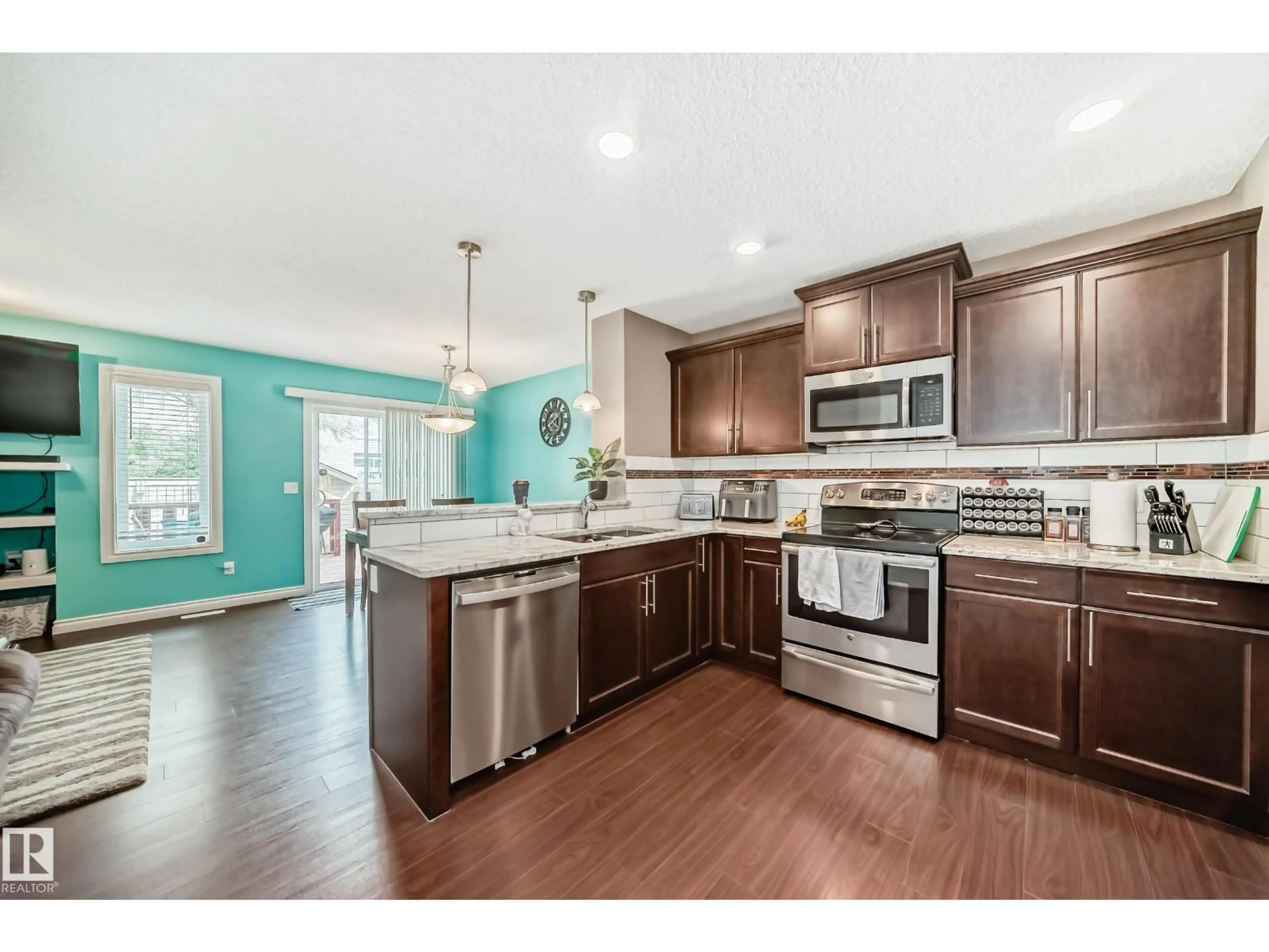 Open concept kitchen, wood/laminate floor for 16813 120 ST NW, Edmonton Alberta T5X0H7