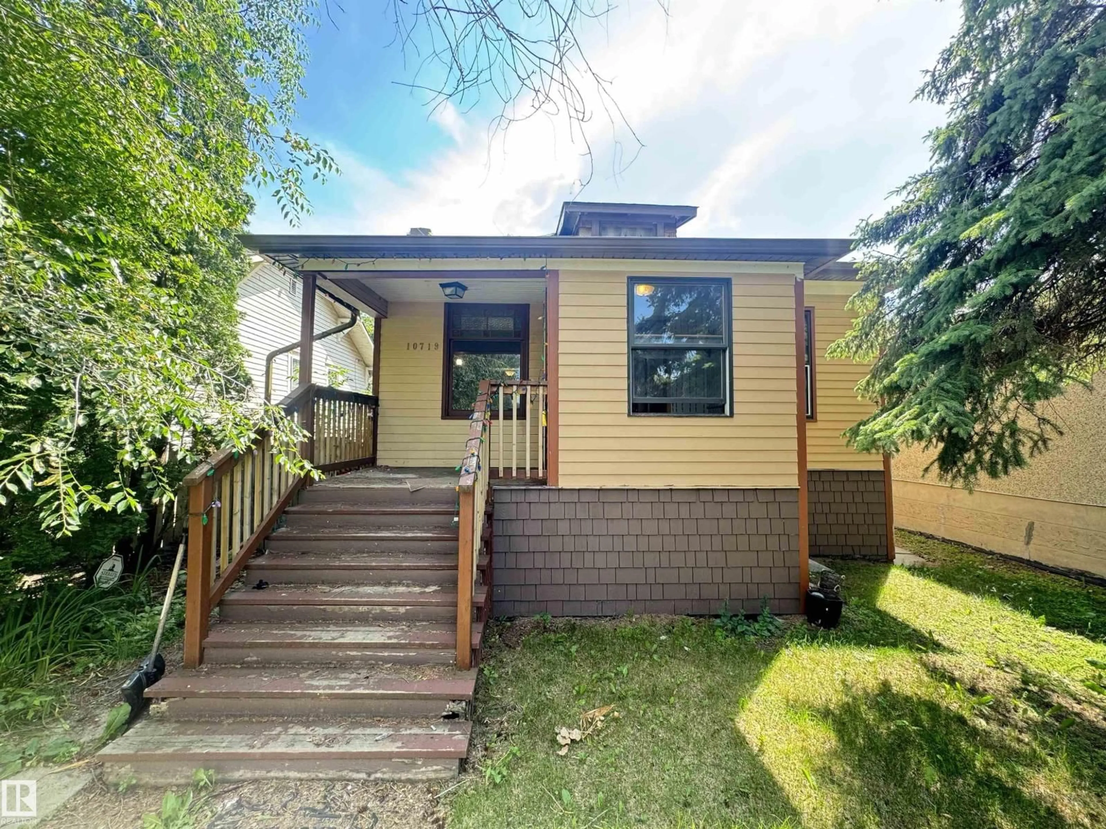 Home with vinyl exterior material, street for 10719 74 AV, Edmonton Alberta T6E1G7