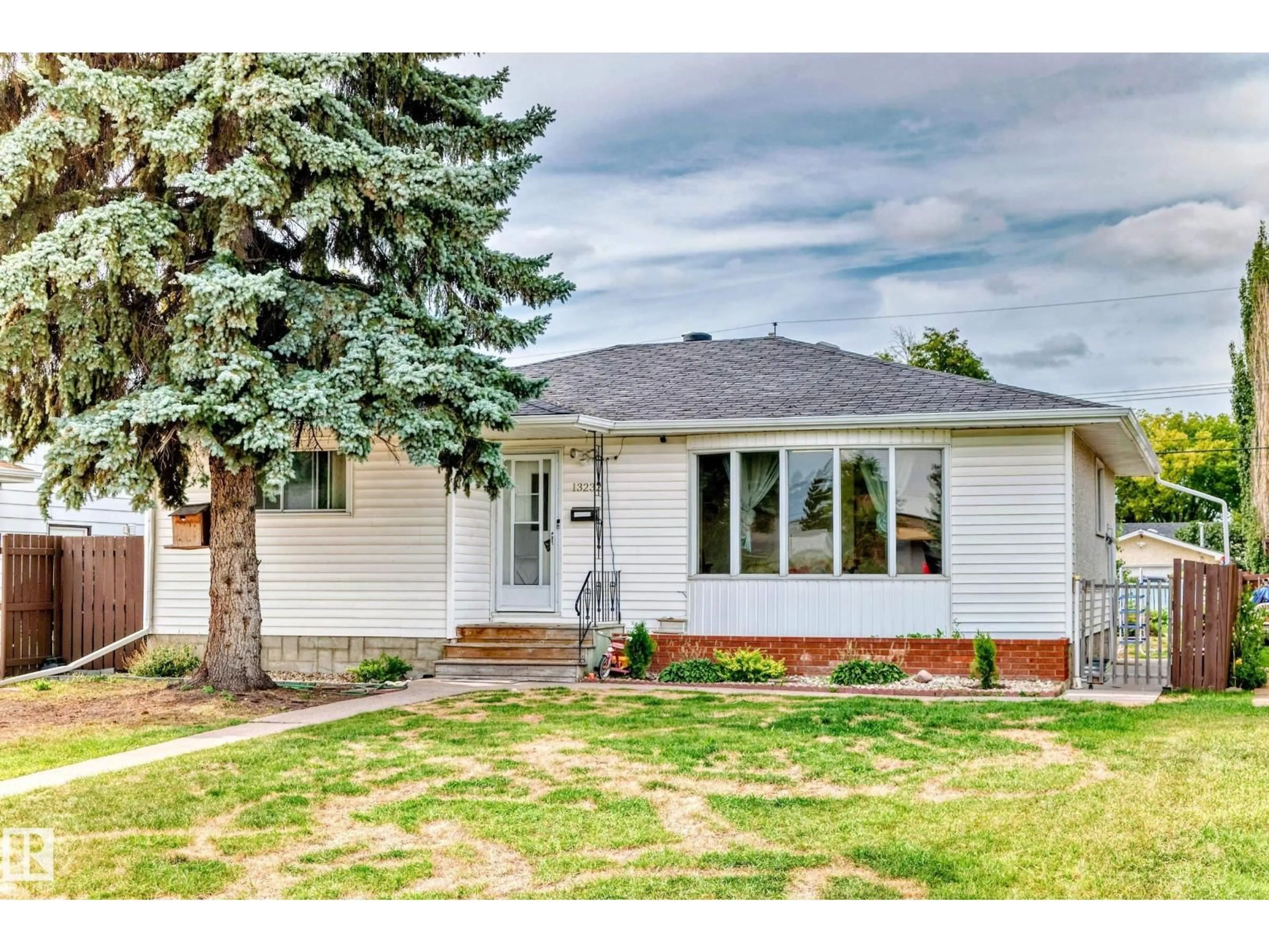 Home with vinyl exterior material, street for NW - 13232 115 ST, Edmonton Alberta T5E5G6