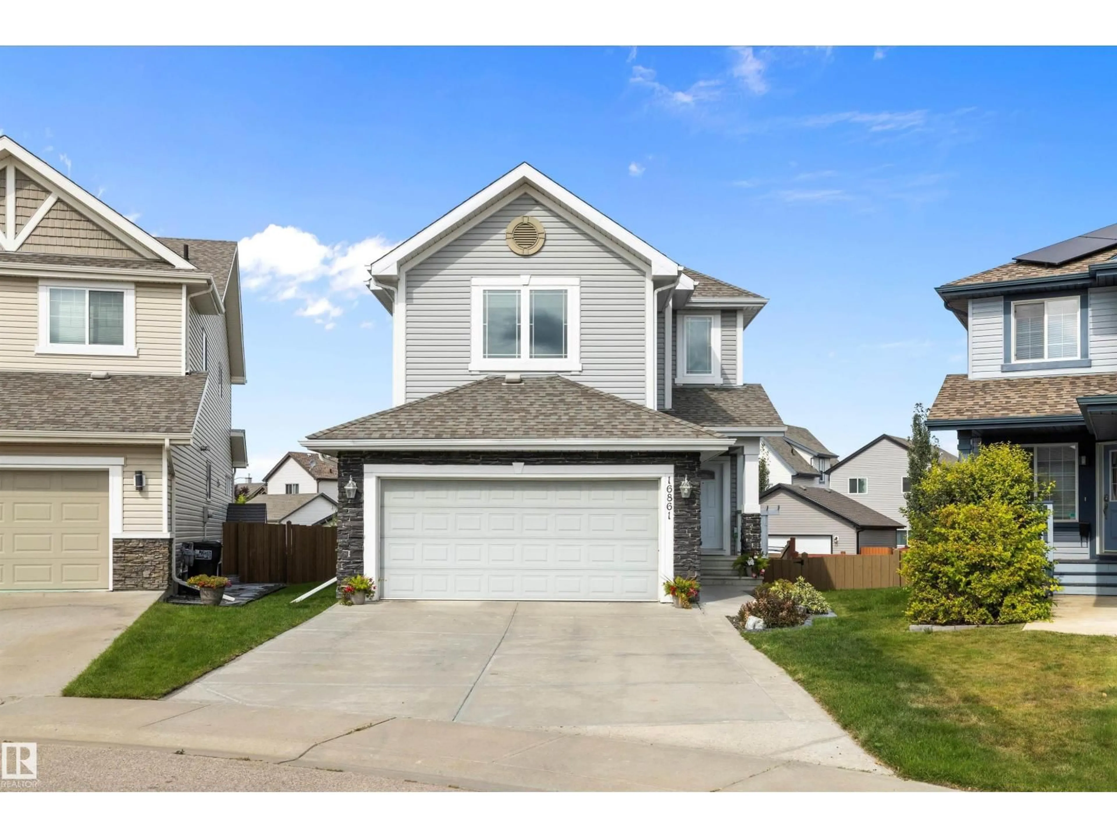 Home with vinyl exterior material, street for 16861 58A ST, Edmonton Alberta T5Y0N1