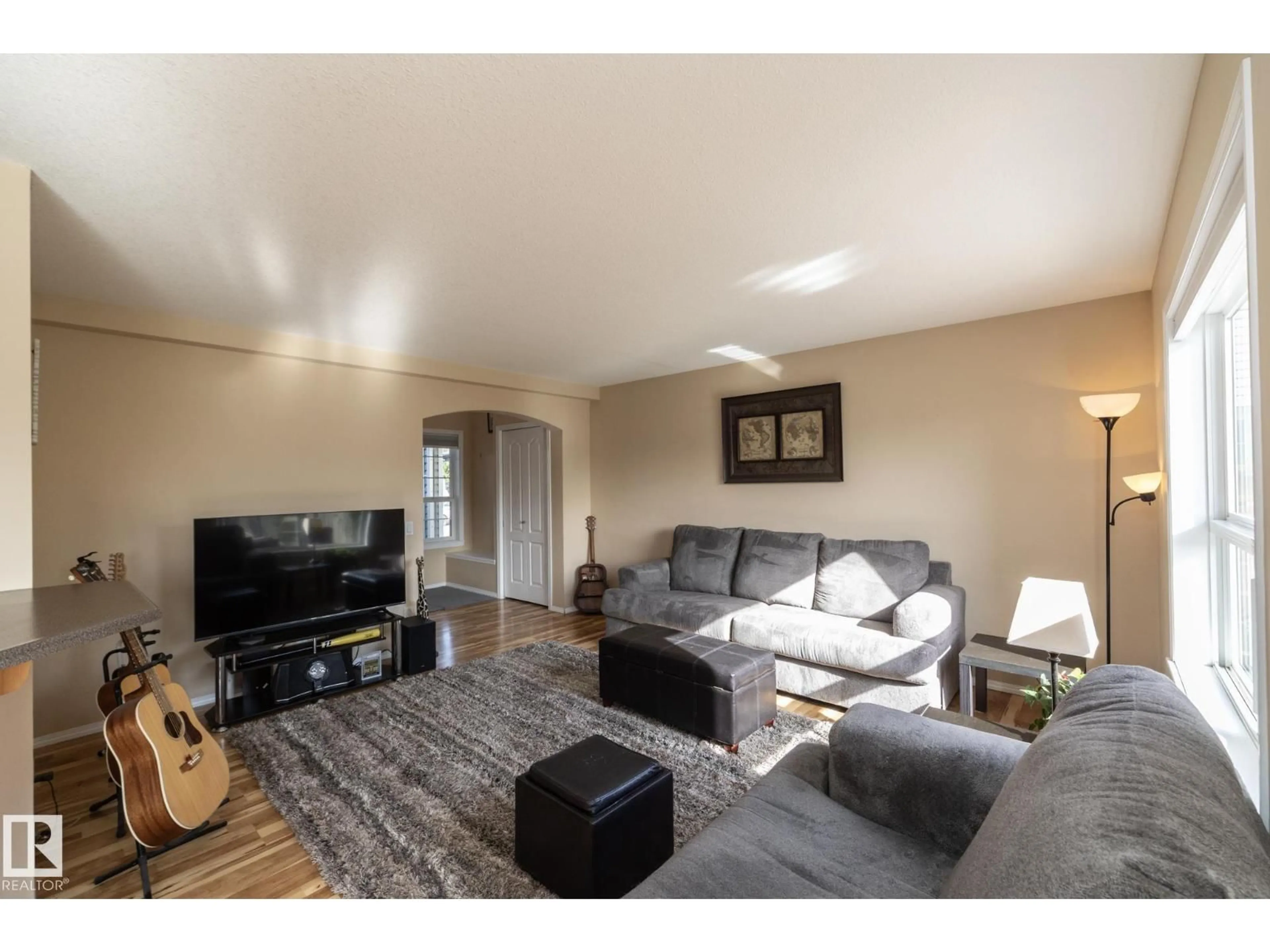 Living room with furniture, wood/laminate floor for 301 BIRCHWOOD DR, Devon Alberta T9G2H9
