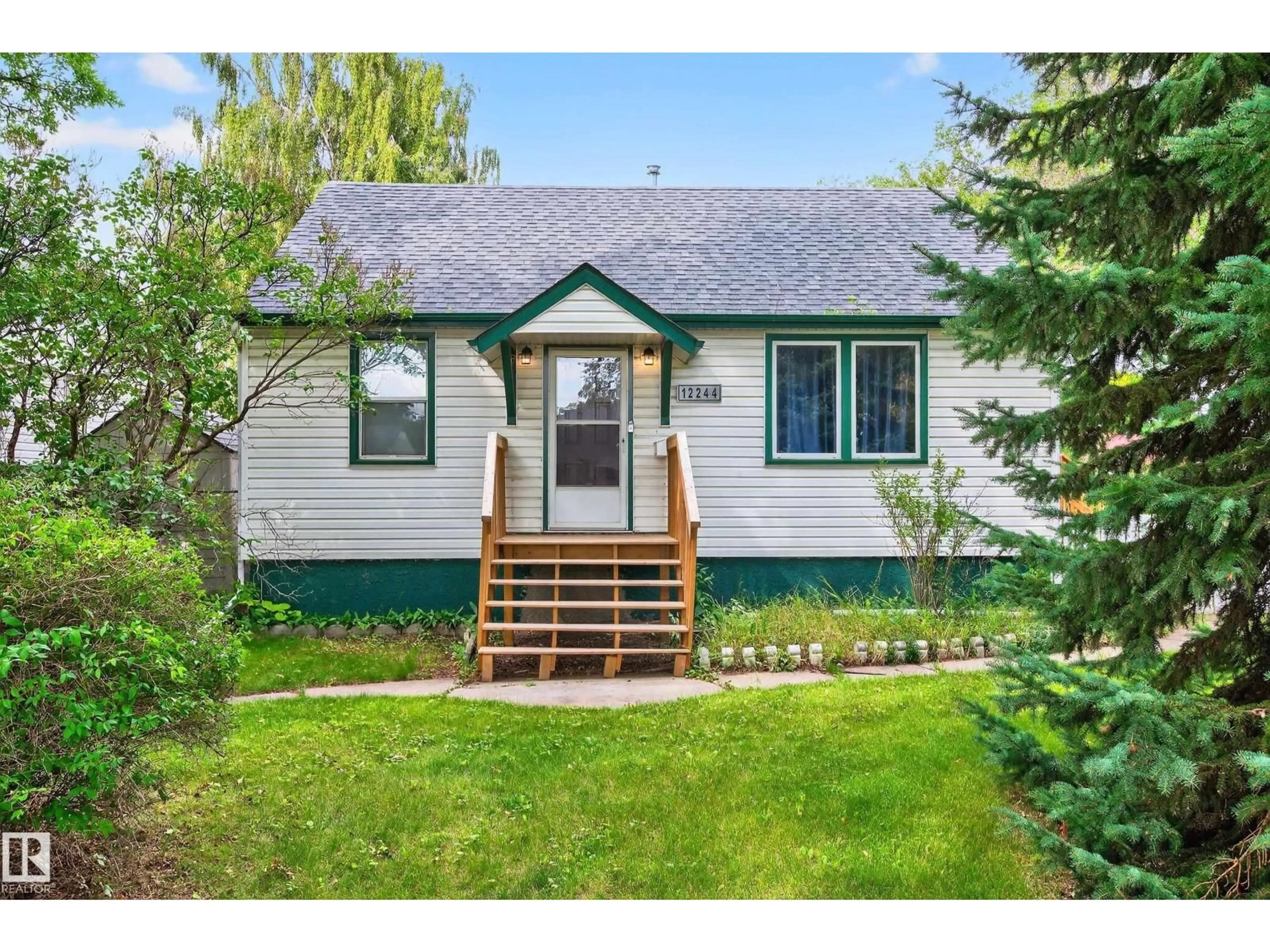 Home with vinyl exterior material, street for NW - 12244 79 ST, Edmonton Alberta T5B2L7