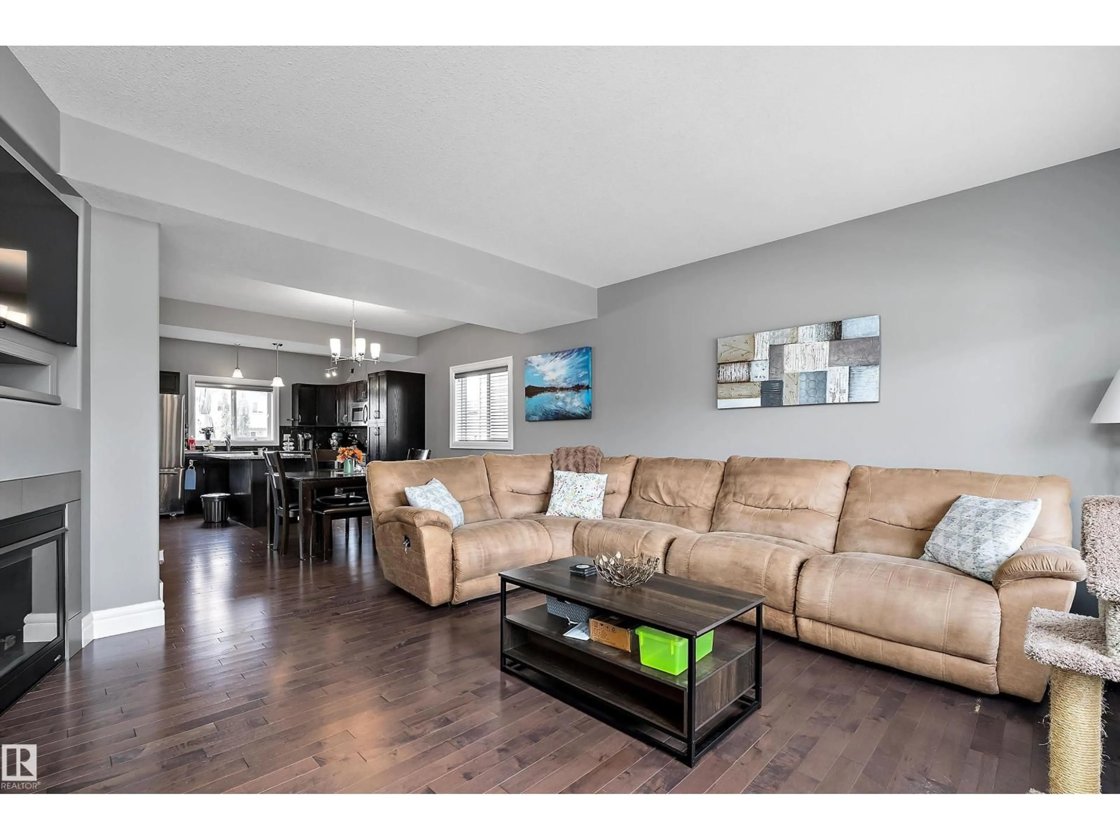 Living room with furniture, wood/laminate floor for 210 SCHUBERT ST, Leduc Alberta T9E8R8