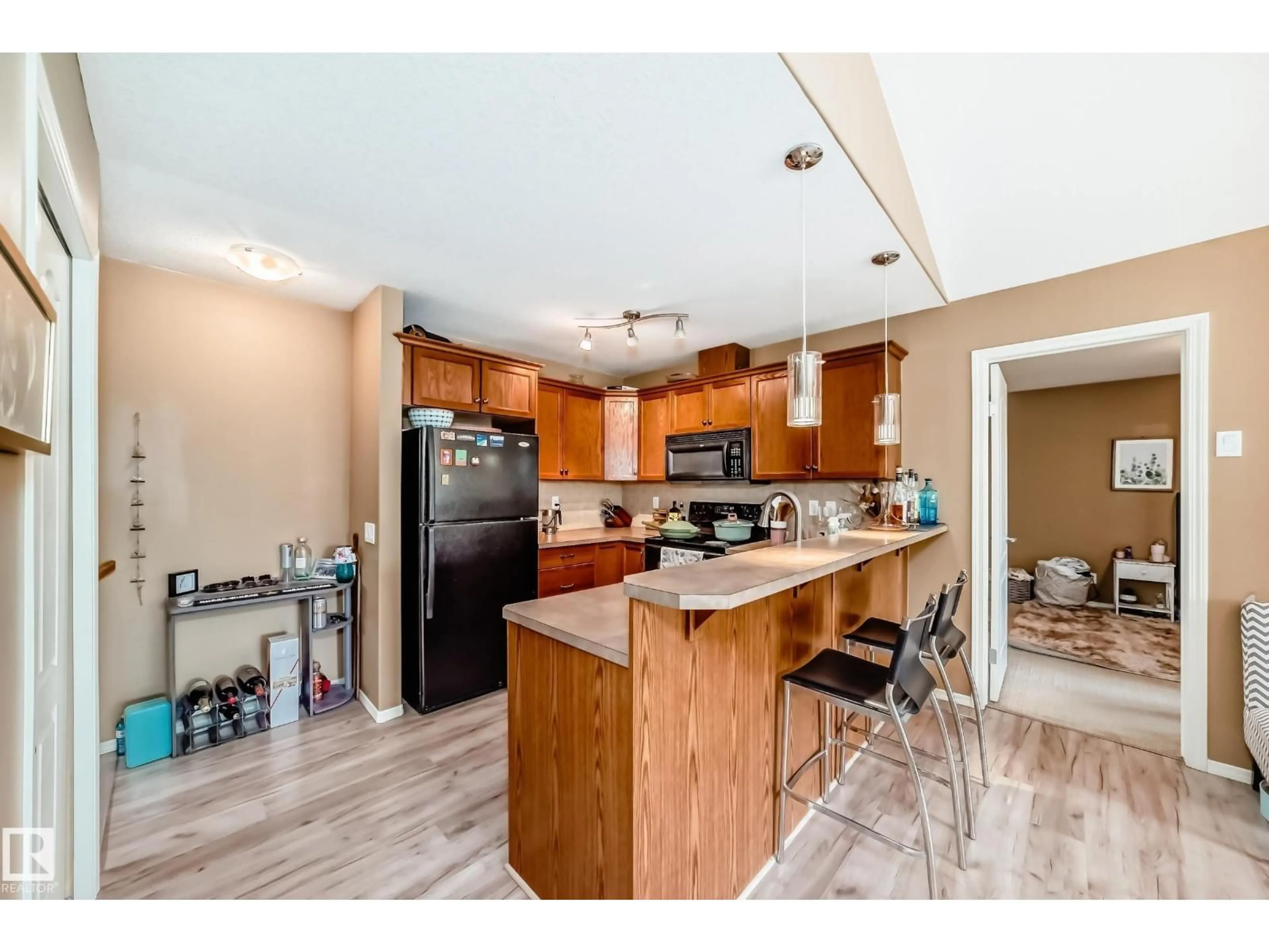 Open concept kitchen, wood/laminate floor for #14 - 671 SILVER BERRY RD, Edmonton Alberta T6T0B7