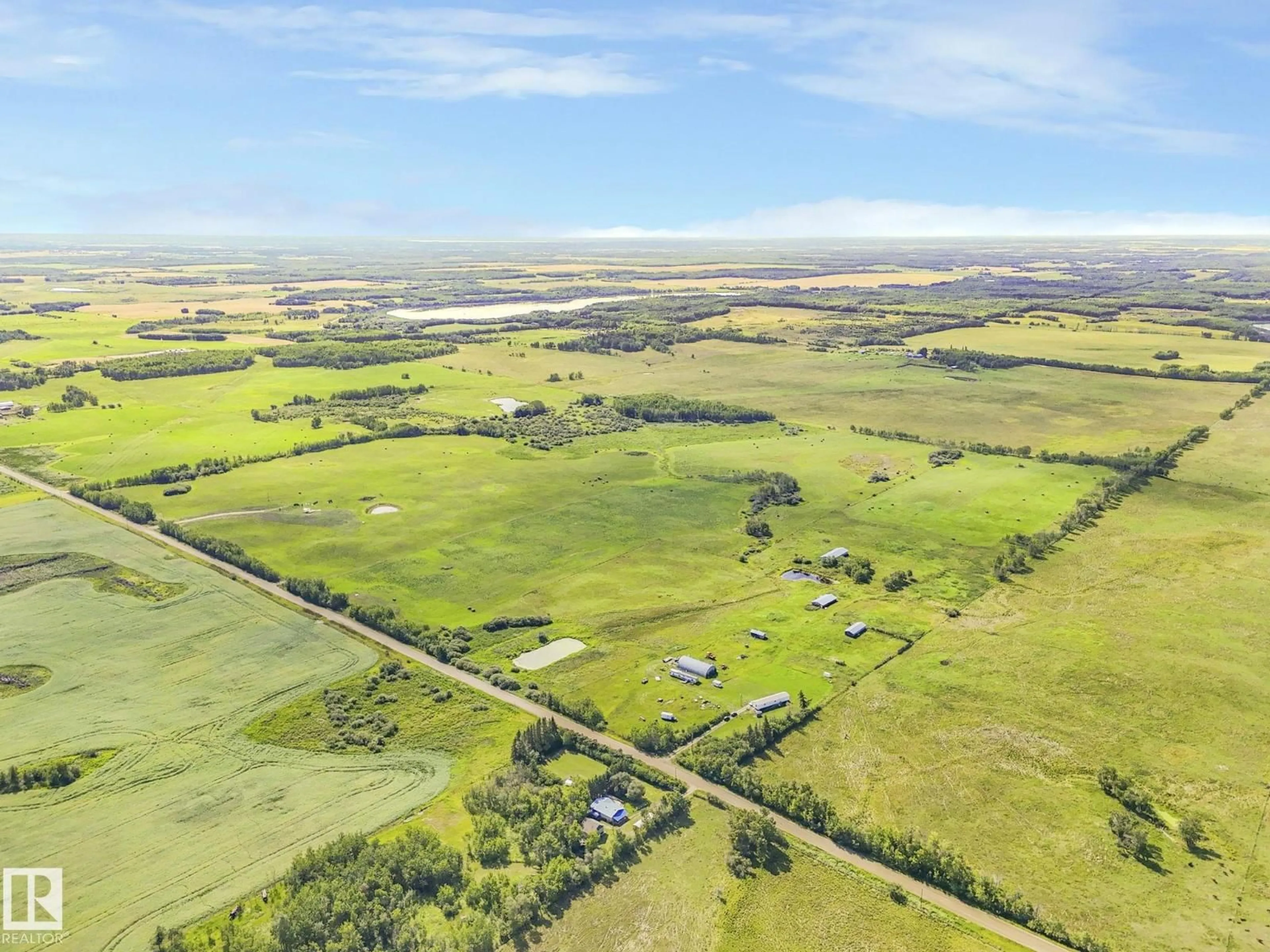 A pic from outside/outdoor area/front of a property/back of a property/a pic from drone, unknown for 56432 HWY 777, Rural Barrhead County Alberta T7N0L6