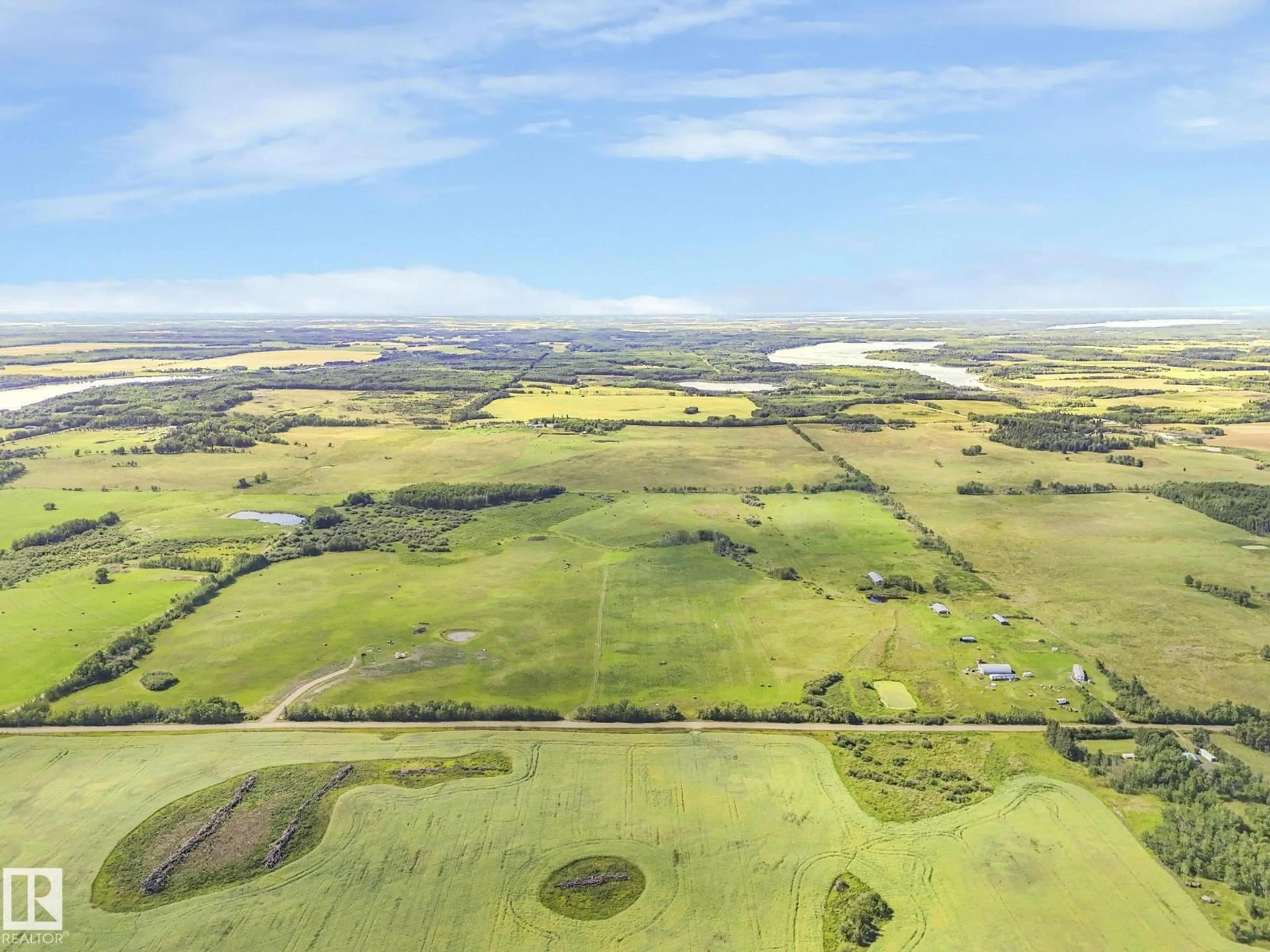 A pic from outside/outdoor area/front of a property/back of a property/a pic from drone, water/lake/river/ocean view for 56432 HWY 777, Rural Barrhead County Alberta T7N0L6