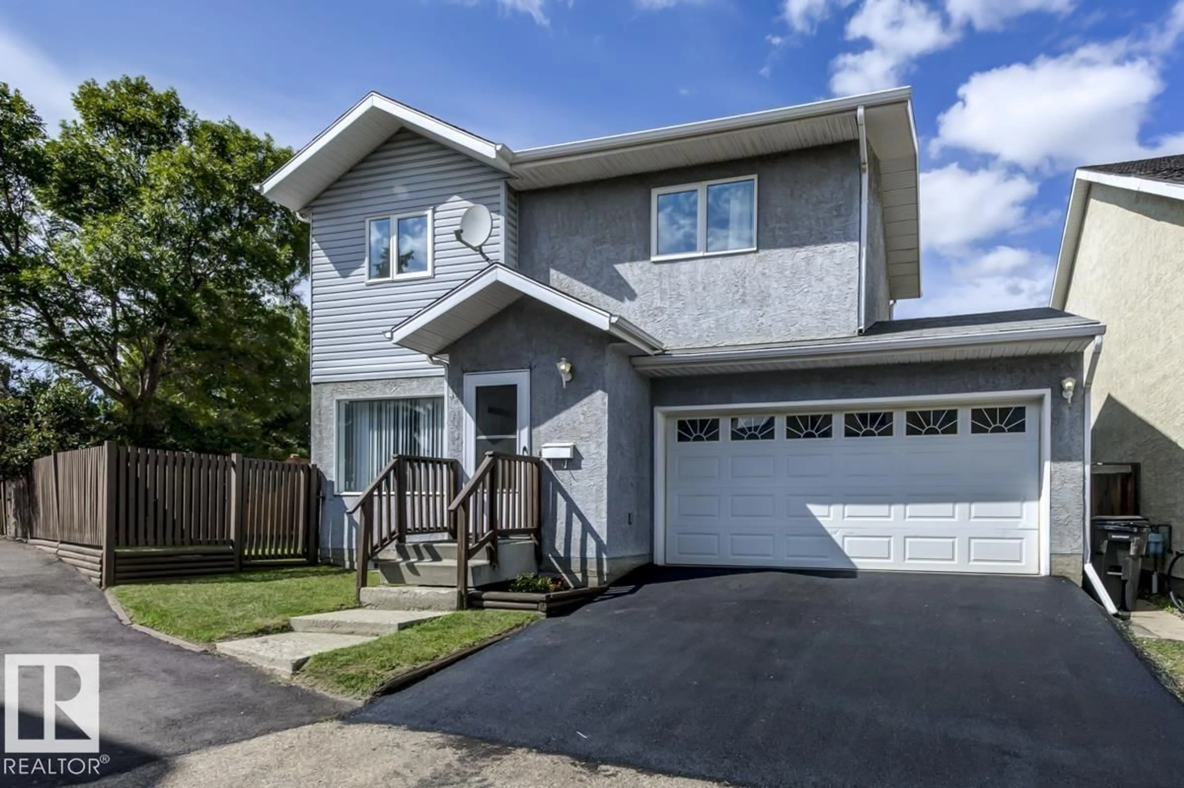 Home with vinyl exterior material, street for NW - 14659 52 ST, Edmonton Alberta T5A4Z7