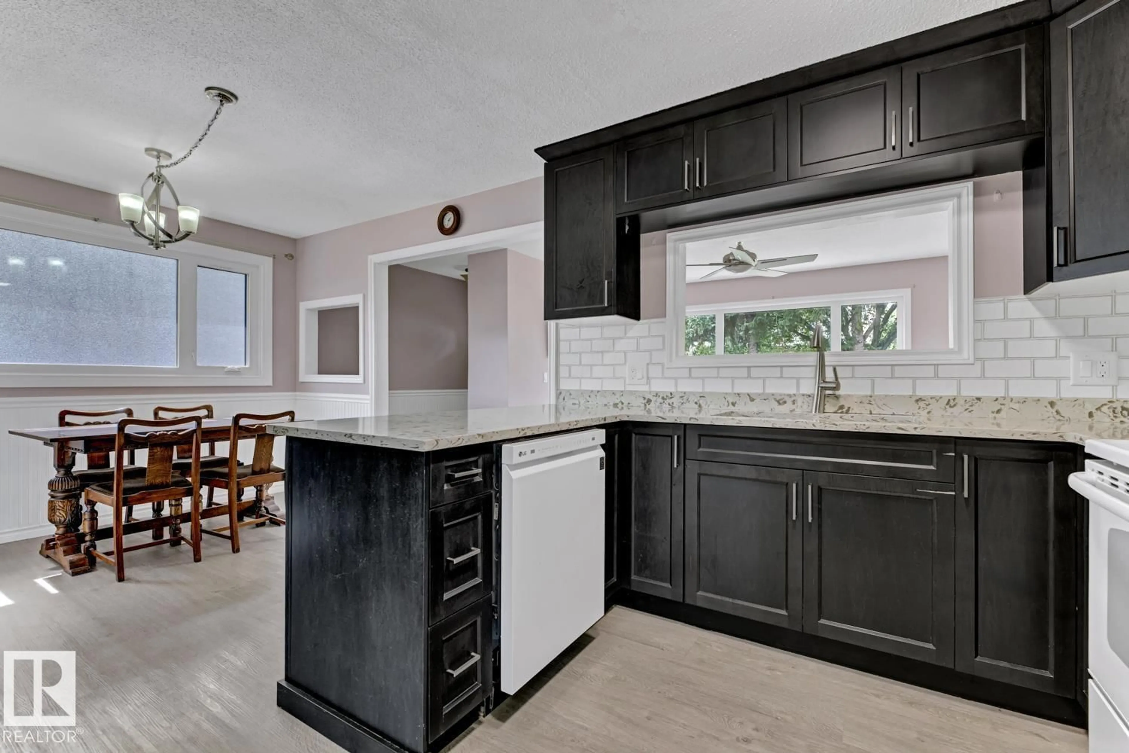 Open concept kitchen, ceramic/tile floor for 4911 106 ST, Edmonton Alberta T6J2S8