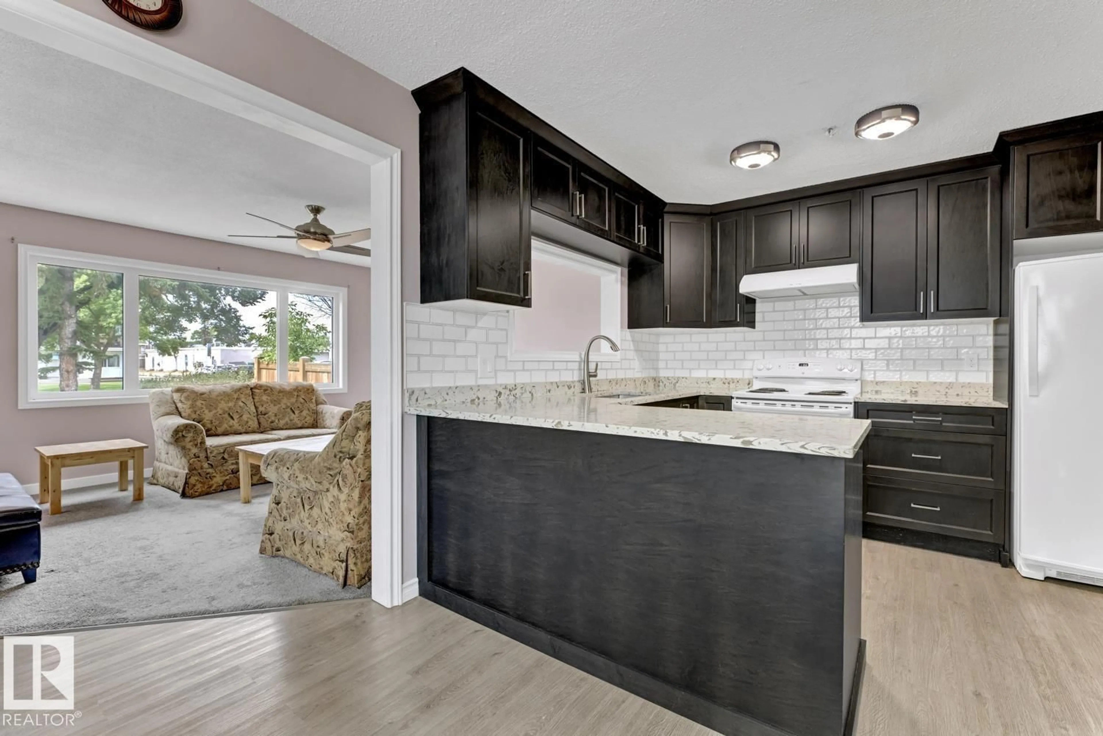 Open concept kitchen, ceramic/tile floor for 4911 106 ST, Edmonton Alberta T6J2S8