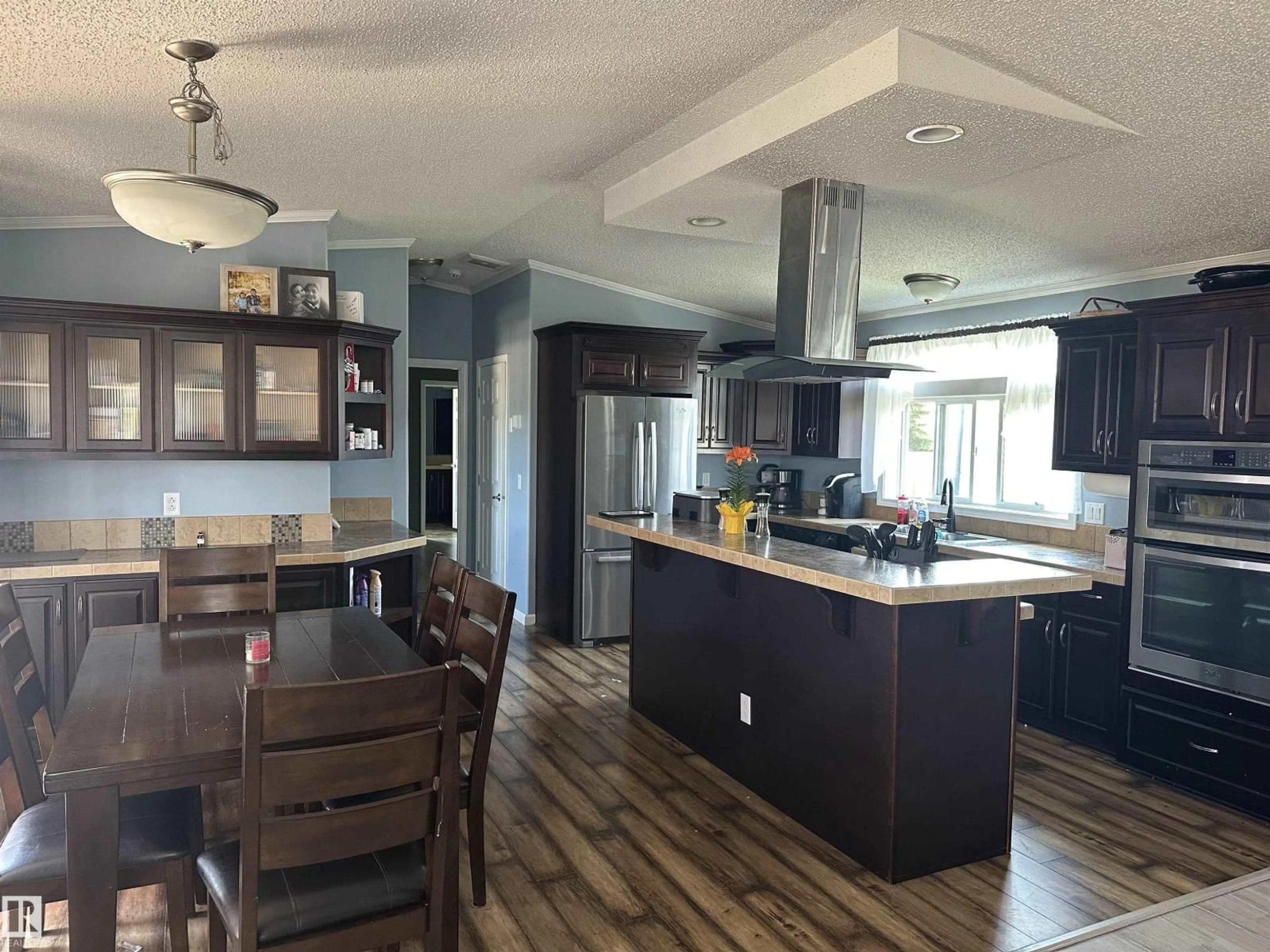 Open concept kitchen, wood/laminate floor for 5101 51 AV, Fort Kent Alberta T0A1H0