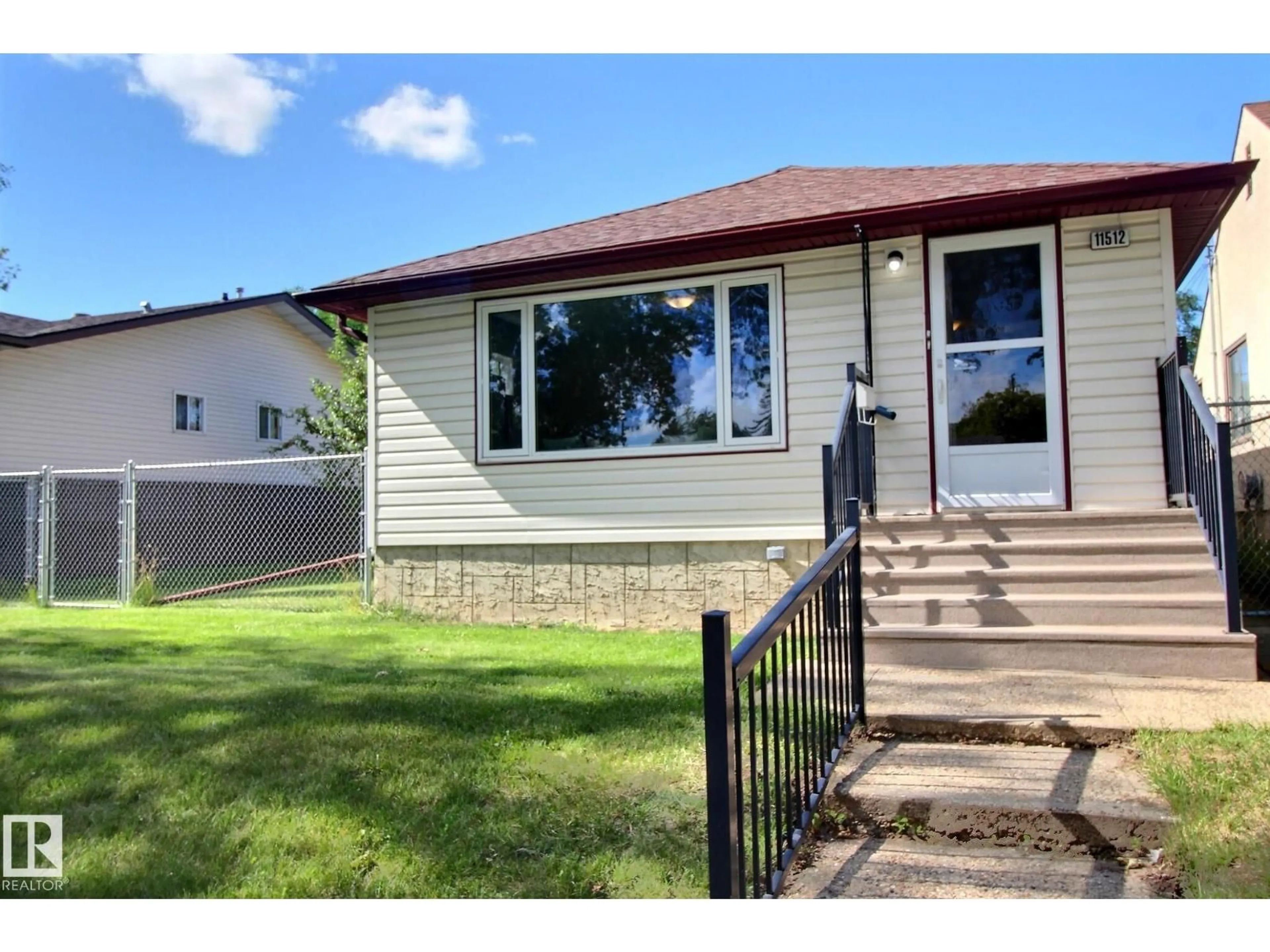 Home with vinyl exterior material, street for NW - 11512 67 ST, Edmonton Alberta T5B1L7