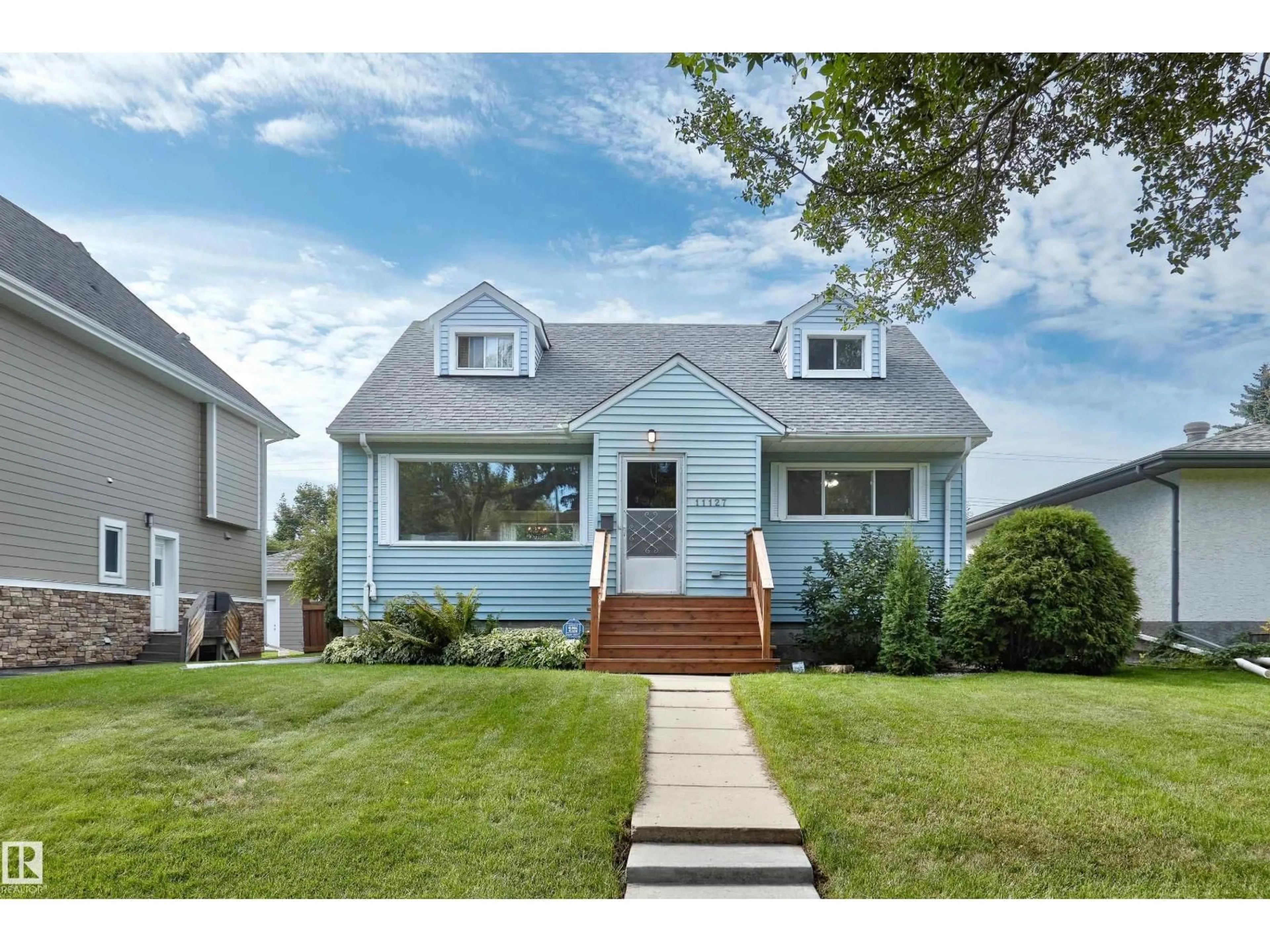 Home with vinyl exterior material, street for 11127 71 AV, Edmonton Alberta T6H3A8