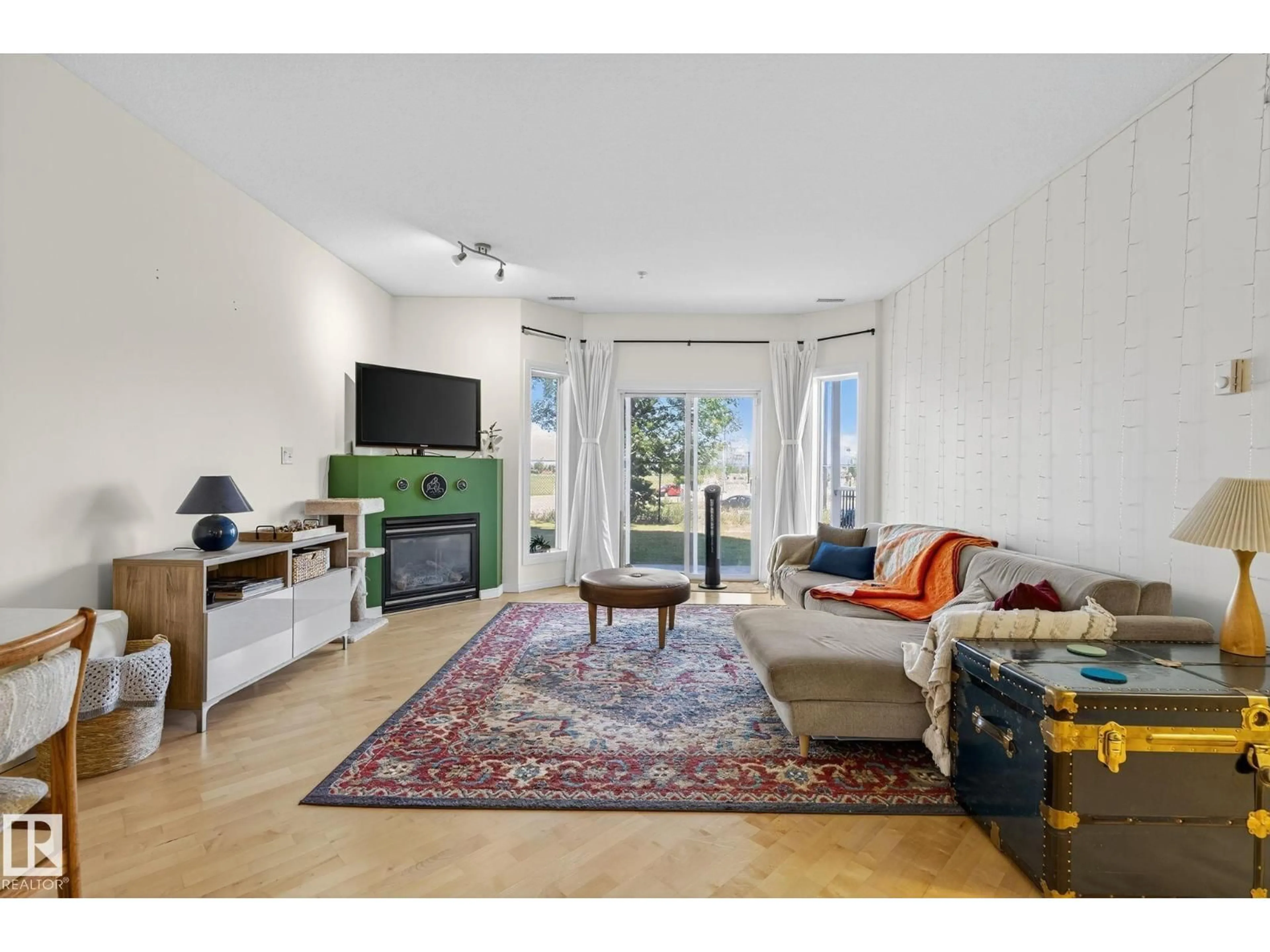 Living room with furniture, unknown for 111 - 4312 139 AV, Edmonton Alberta T5Y3J4