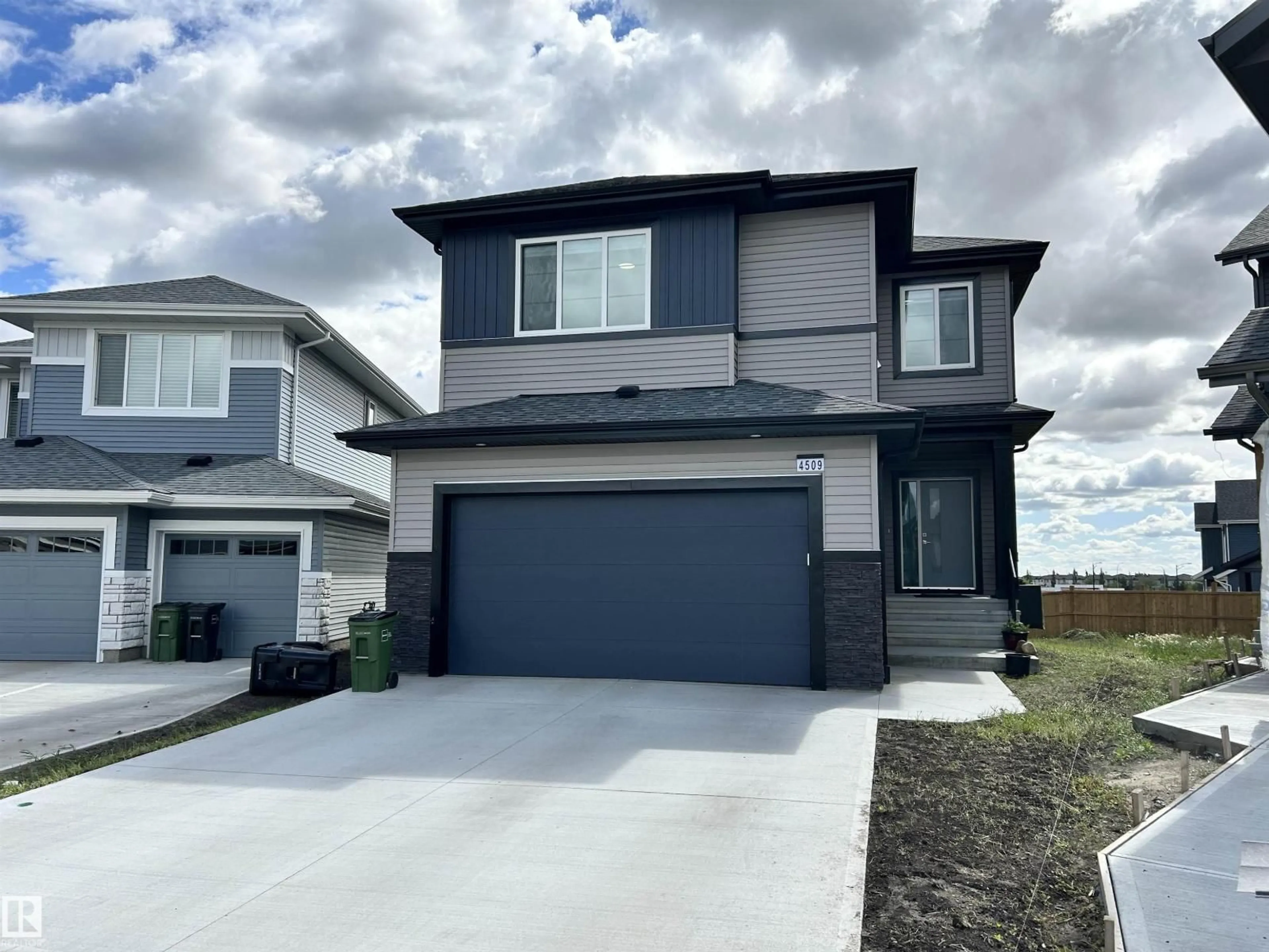 Home with vinyl exterior material, street for 4509 170A AV, Edmonton Alberta T5Y4C9