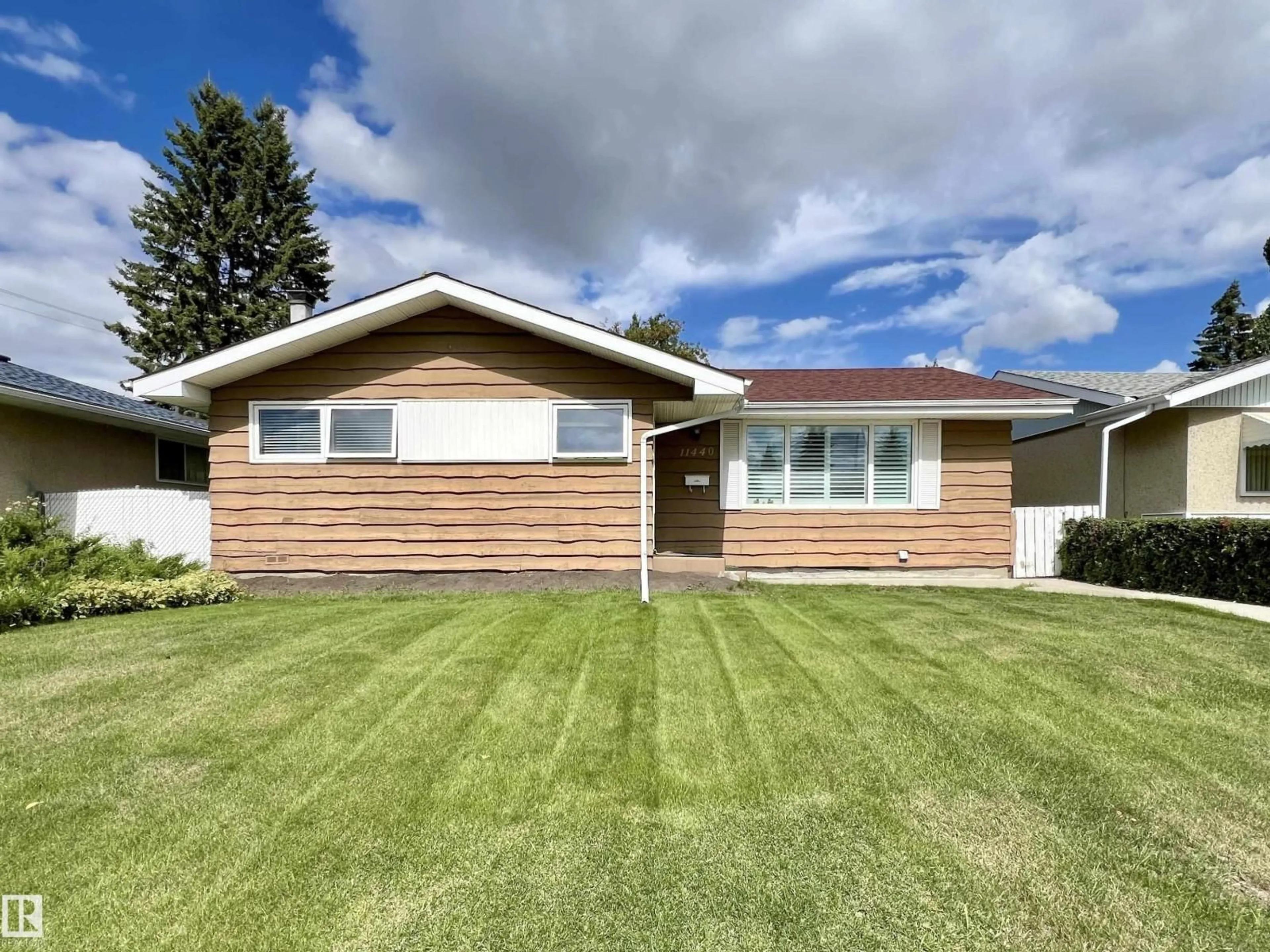 Home with vinyl exterior material, street for 11440 MALMO RD, Edmonton Alberta T6H4M2