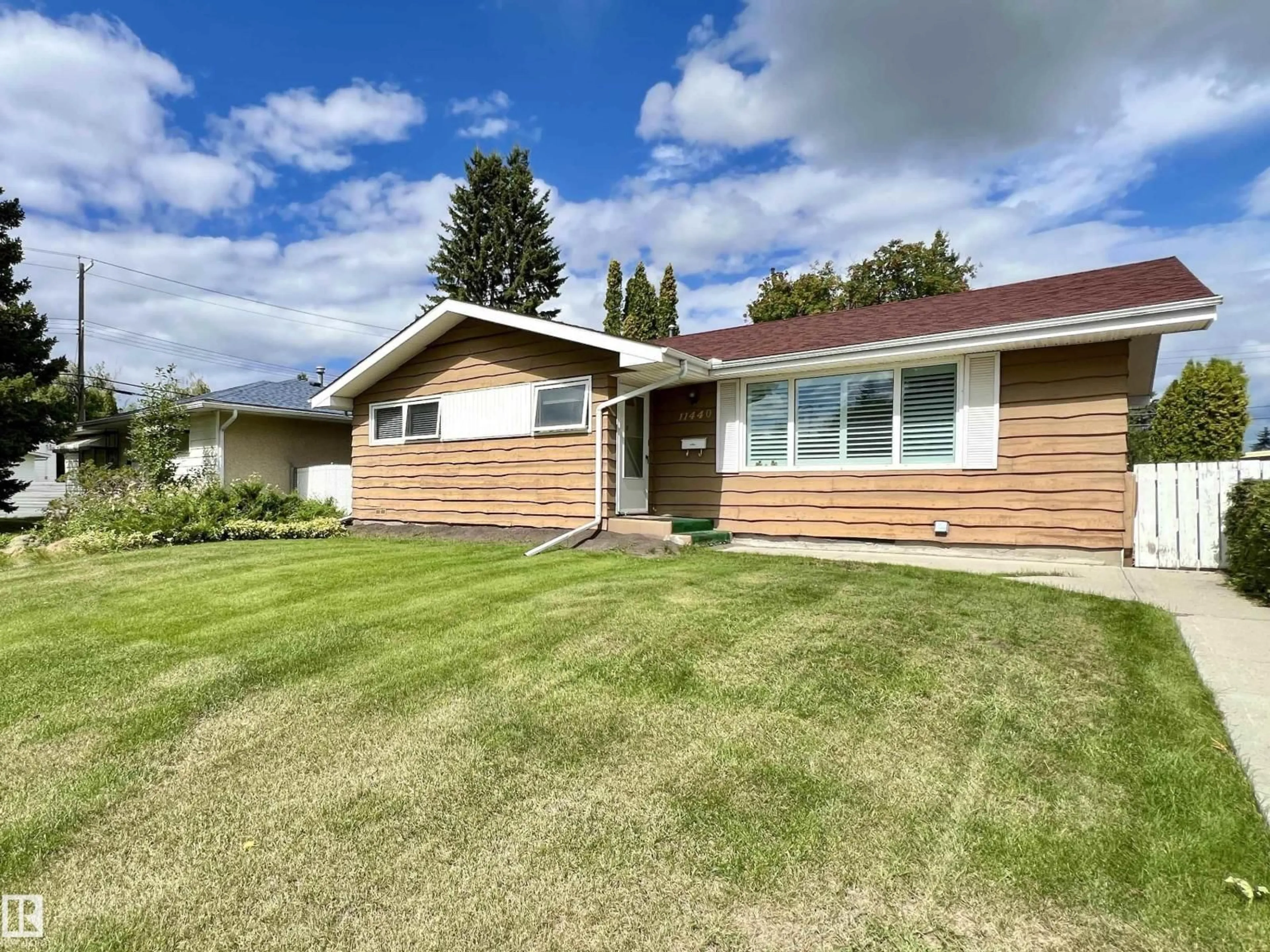 Home with vinyl exterior material, street for 11440 MALMO RD, Edmonton Alberta T6H4M2
