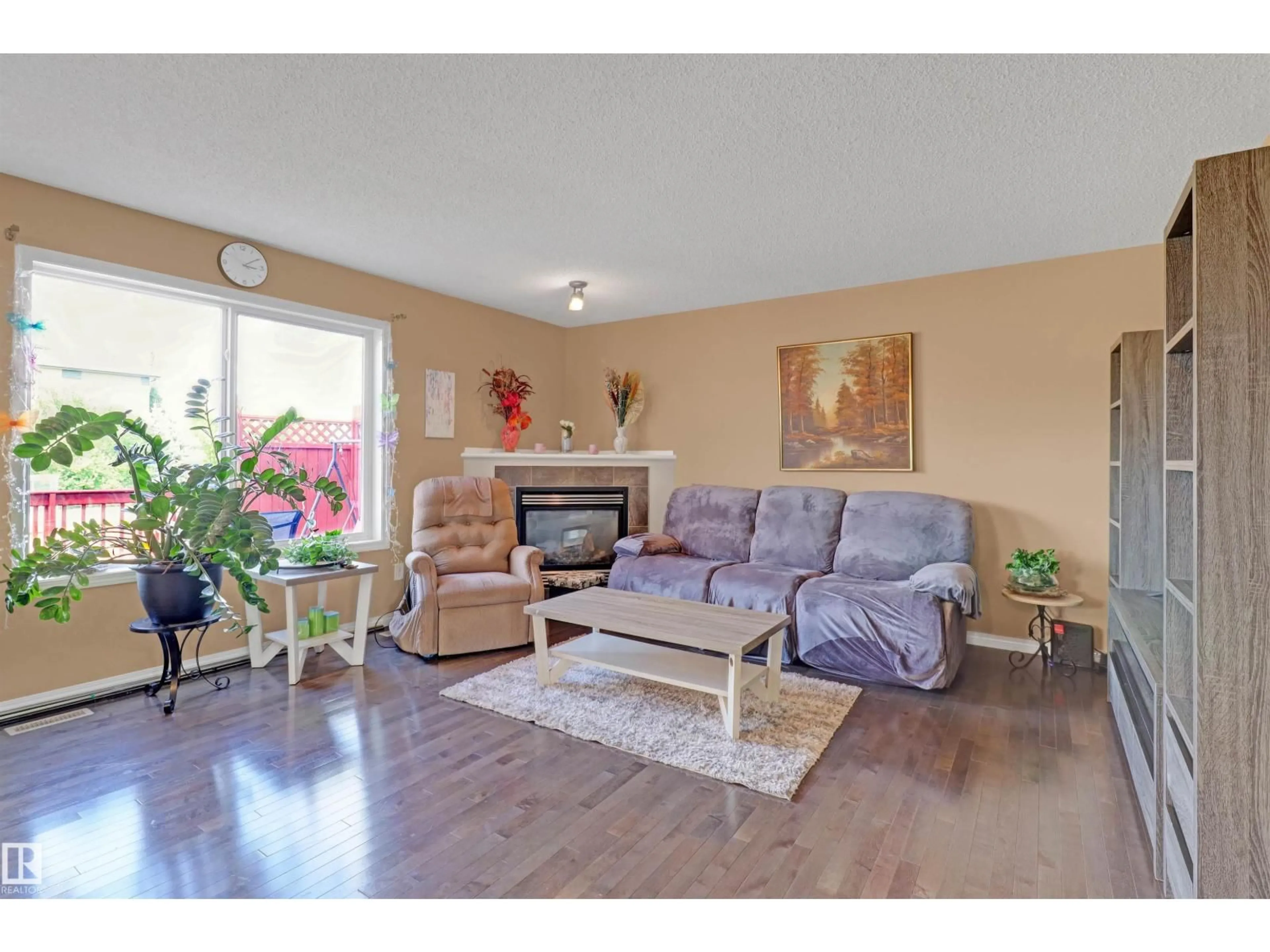 Living room with furniture, wood/laminate floor for 1216 36C AVE AVE, Edmonton Alberta T6T0E5