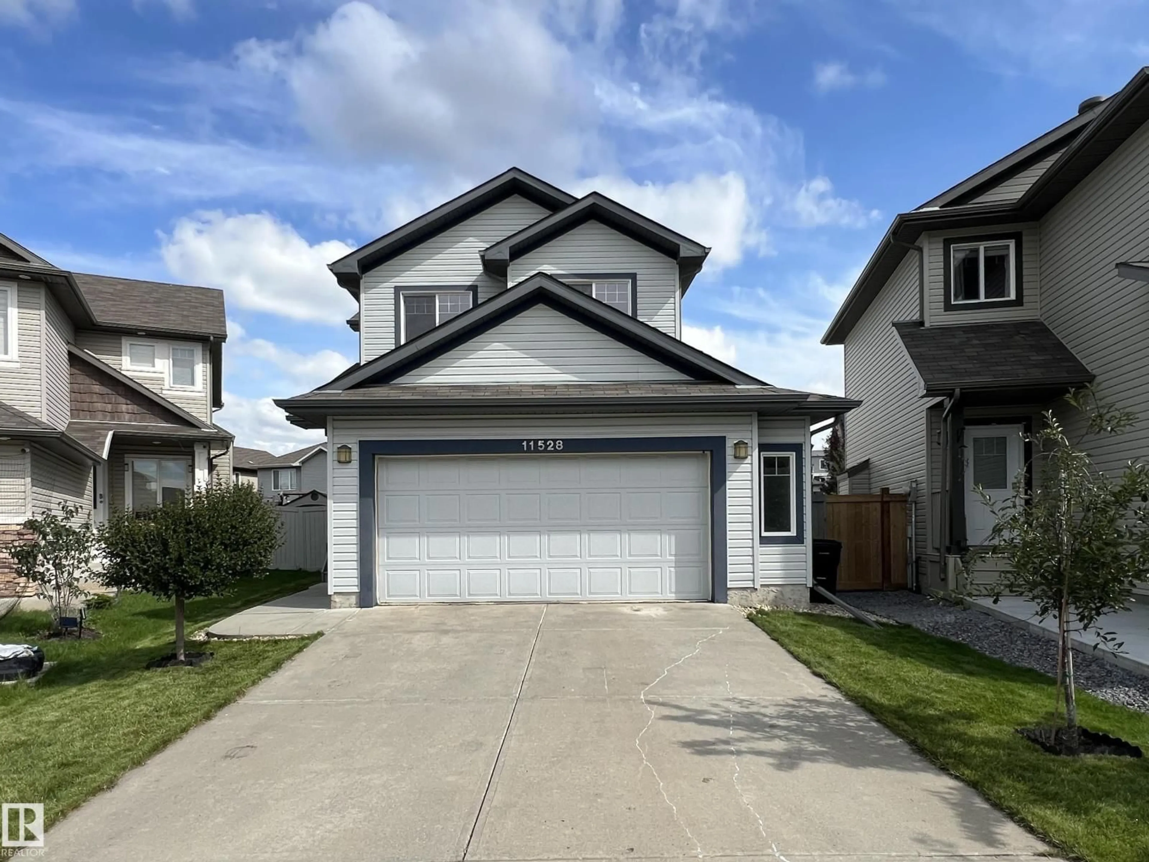 Home with vinyl exterior material, street for 11528 16 AV, Edmonton Alberta T6W0Z9