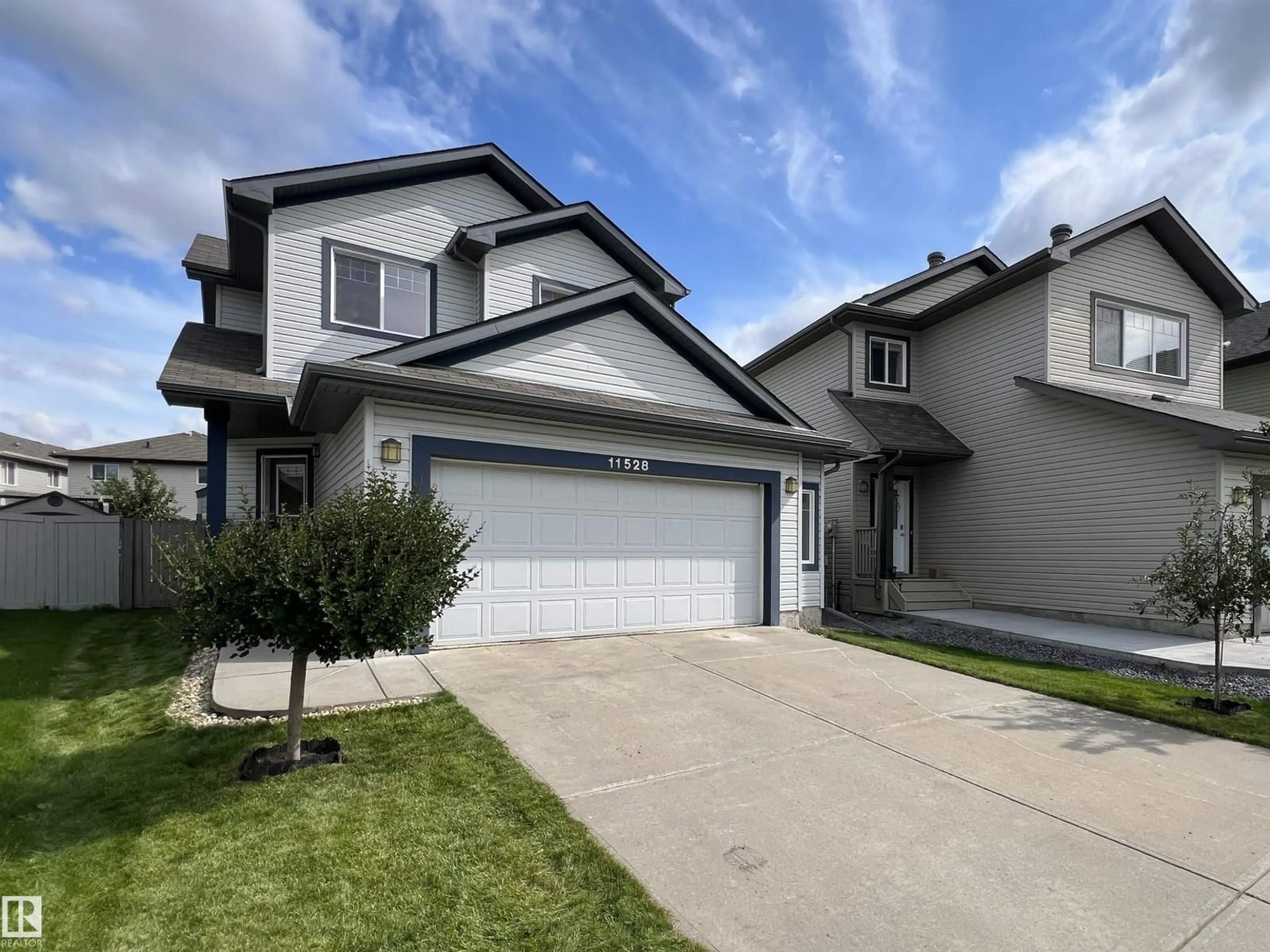 Home with vinyl exterior material, street for 11528 16 AV, Edmonton Alberta T6W0Z9