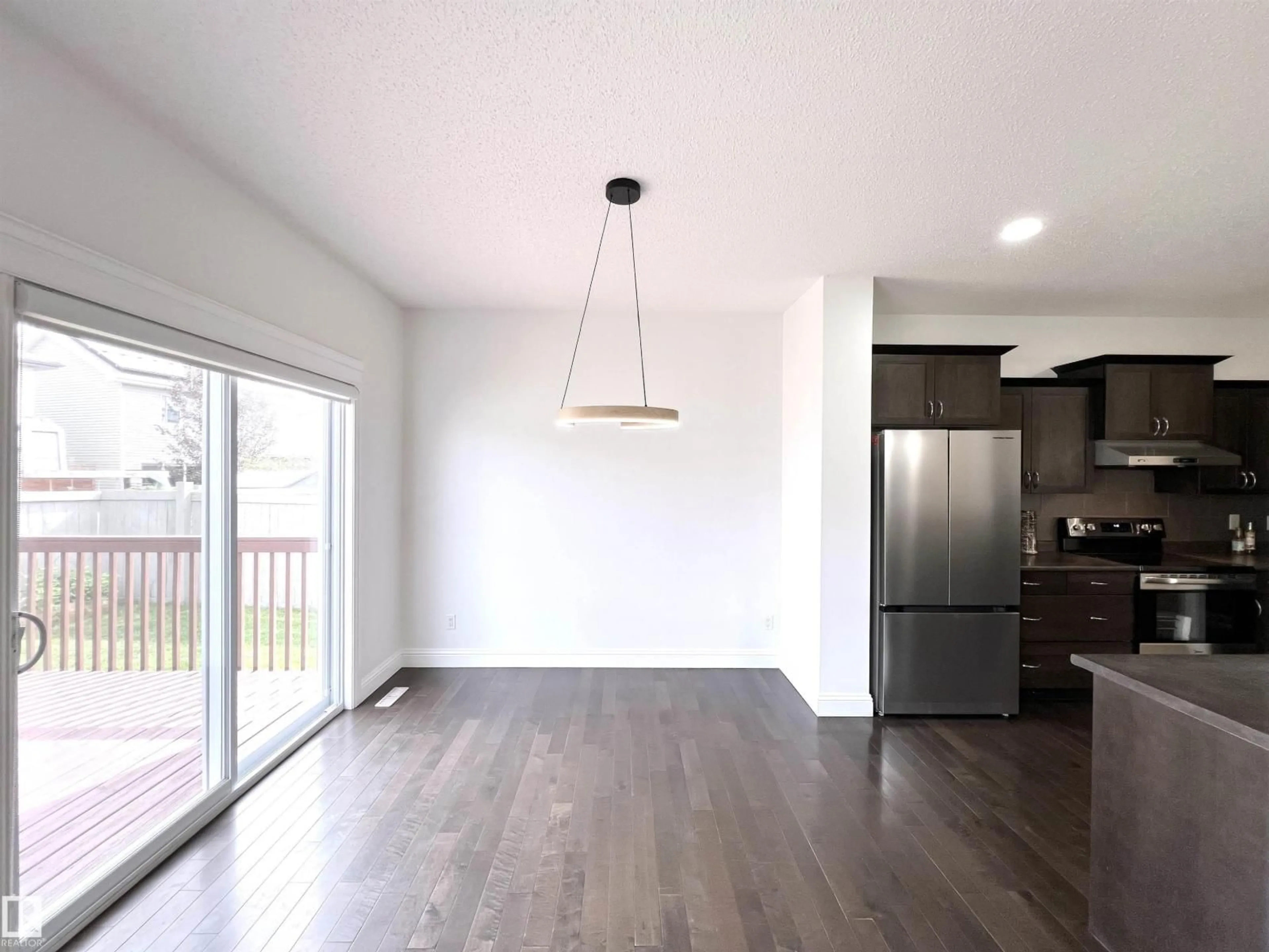 Open concept kitchen, wood/laminate floor for 11528 16 AV, Edmonton Alberta T6W0Z9