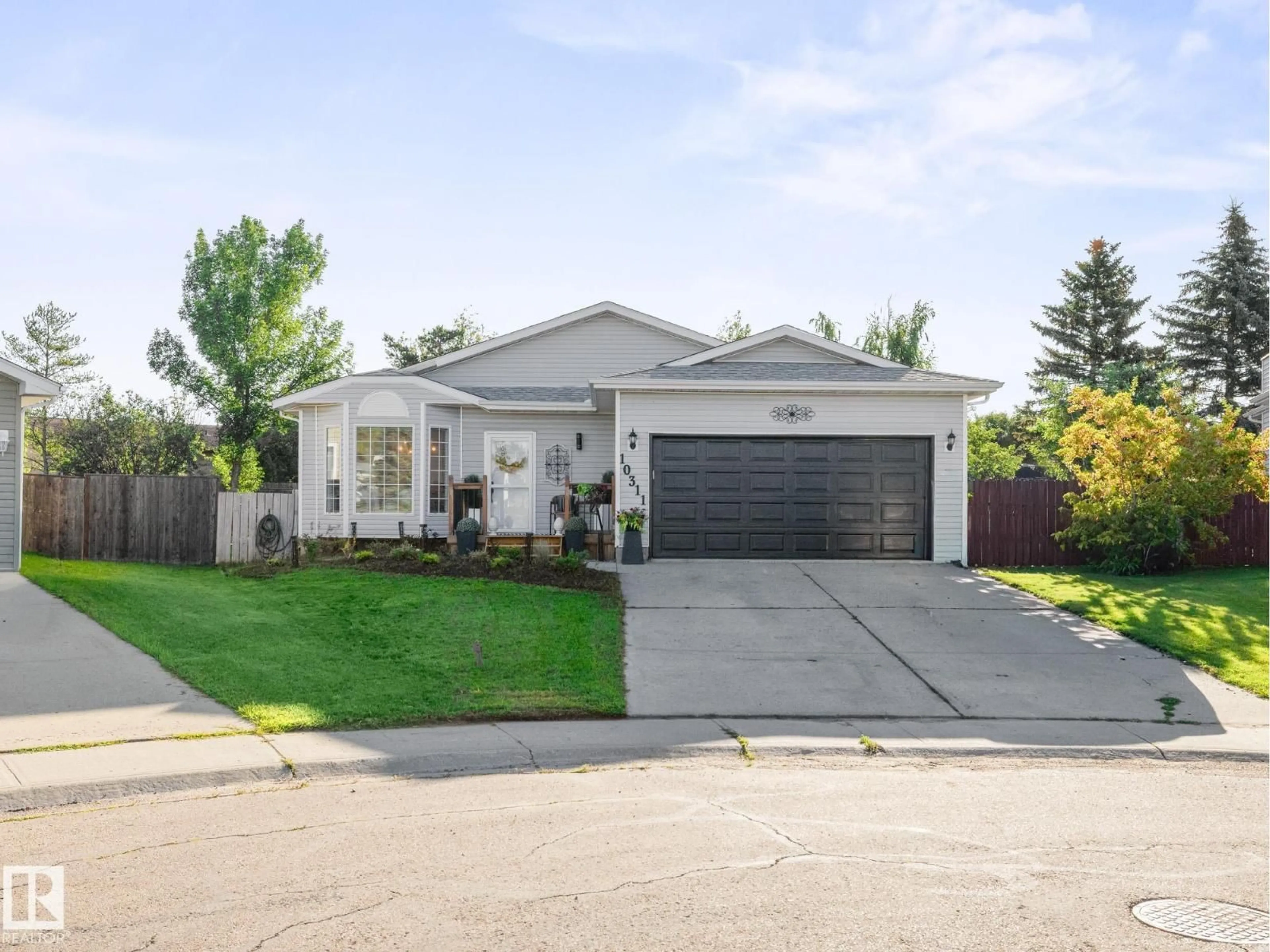 Home with vinyl exterior material, street for 10311 87A ST, Morinville Alberta T8R1C4