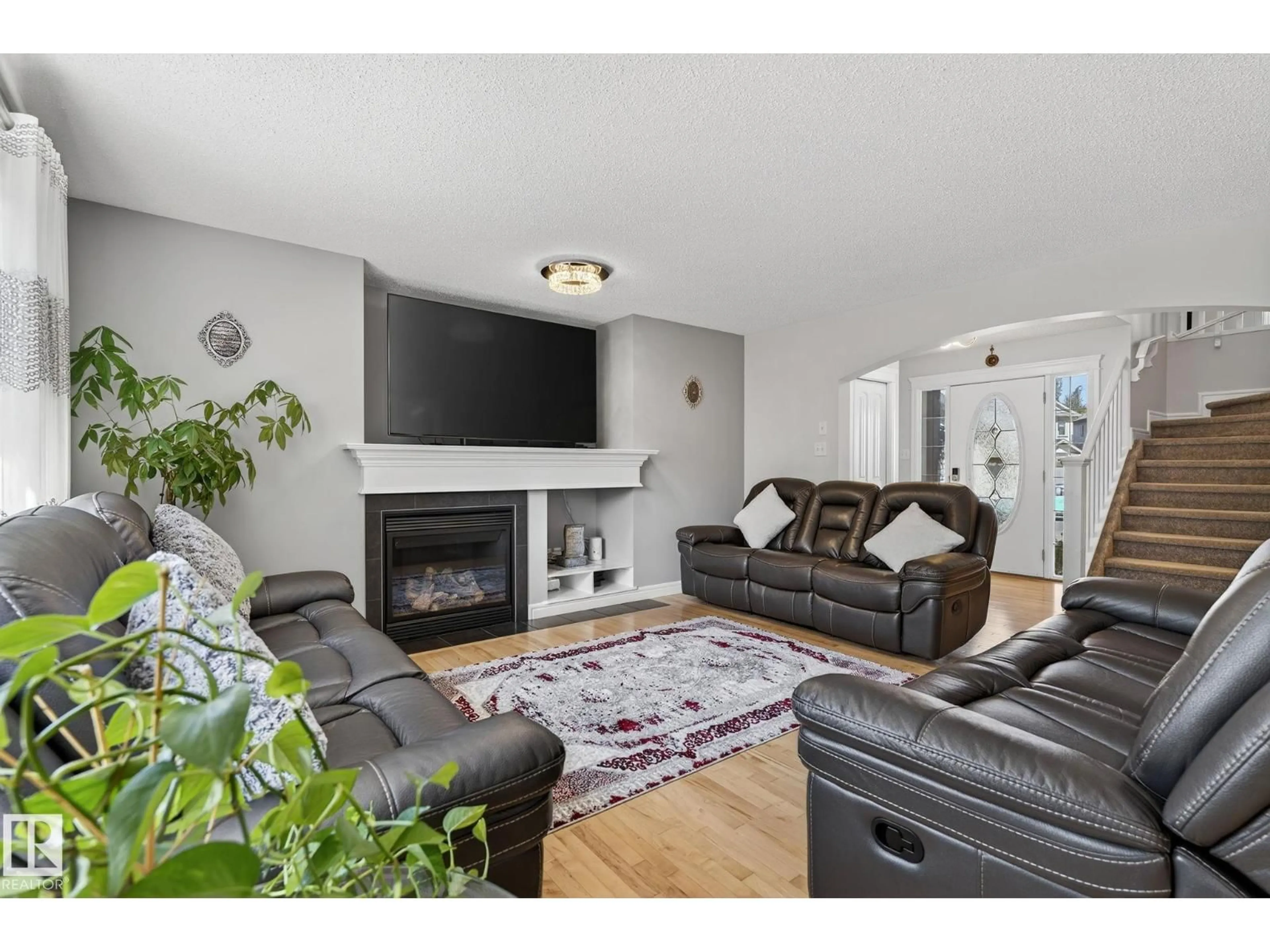 Living room with furniture, wood/laminate floor for 20343 46 AV, Edmonton Alberta T6M0A7