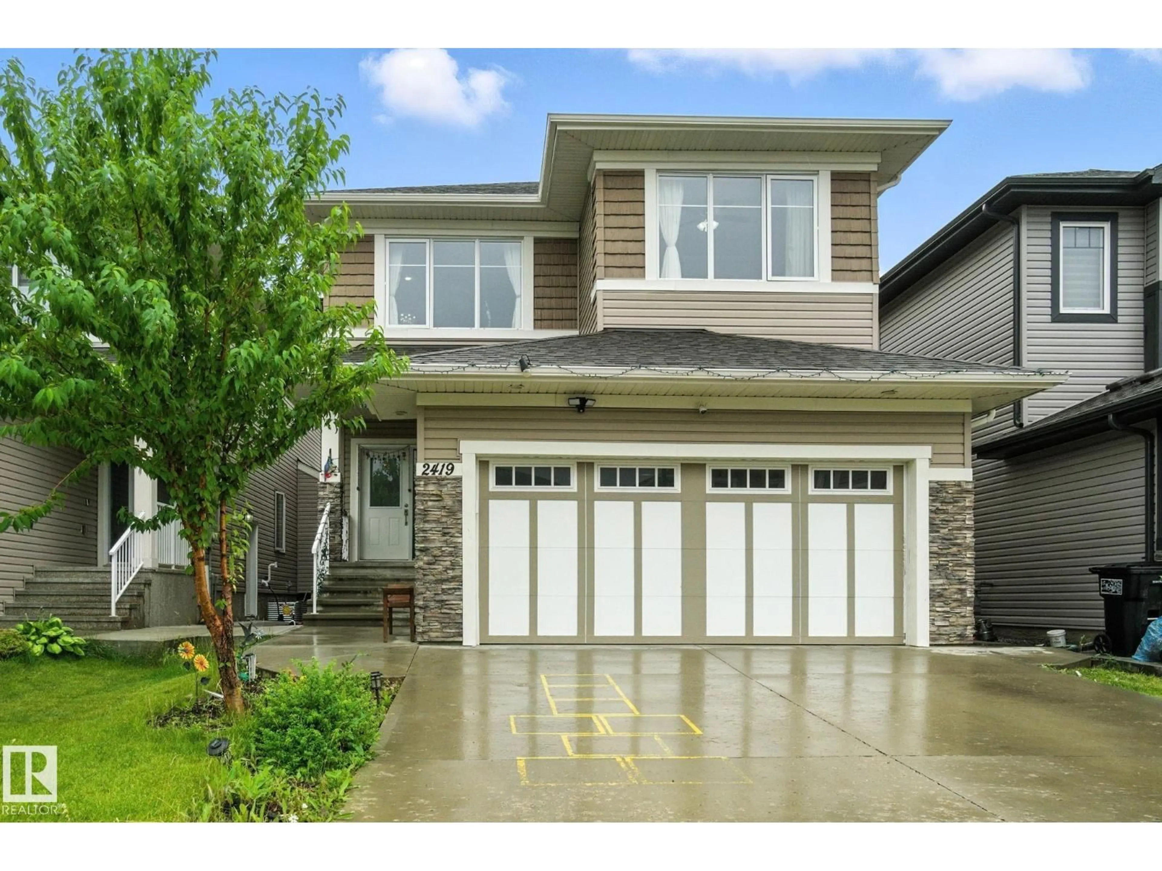 Home with vinyl exterior material, street for 2419 17 AV, Edmonton Alberta T6T2G8