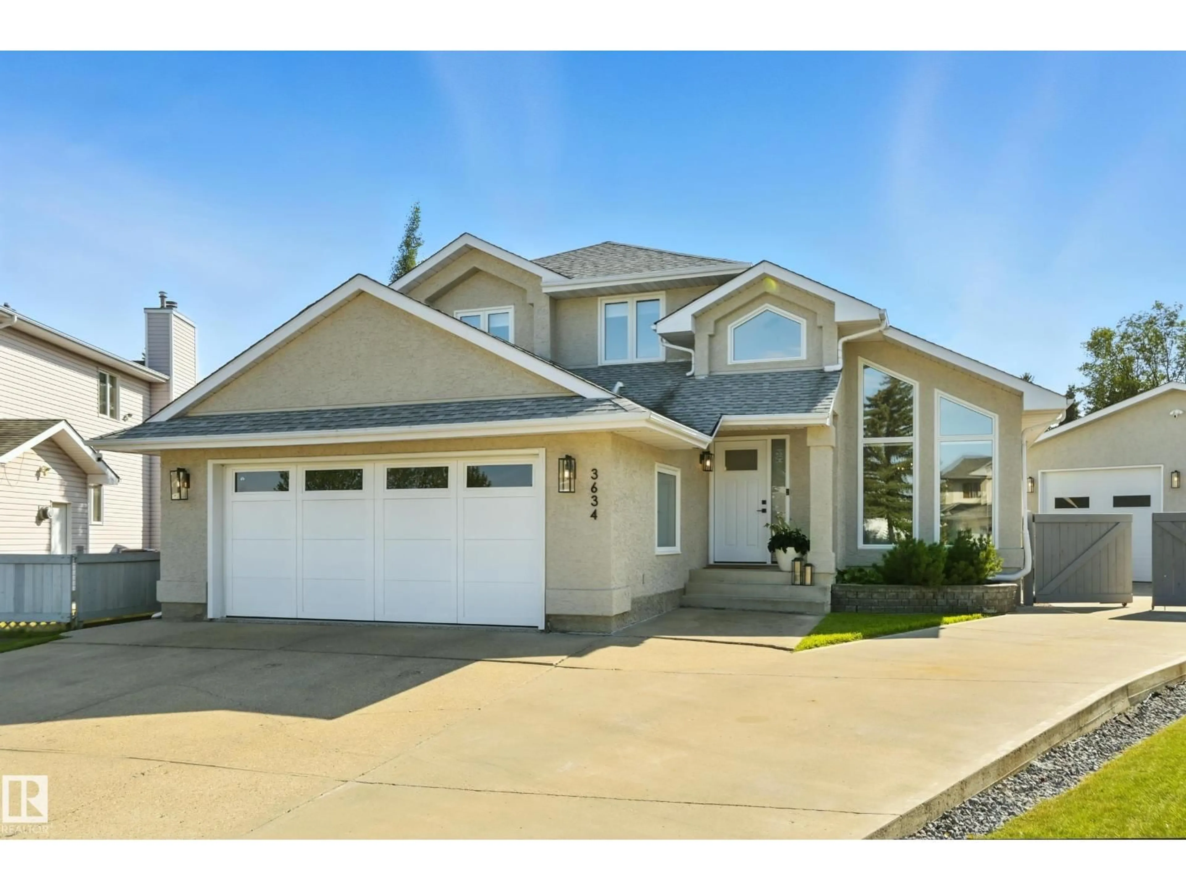 Home with vinyl exterior material, street for NW - 3634 31A ST, Edmonton Alberta T6T1H3