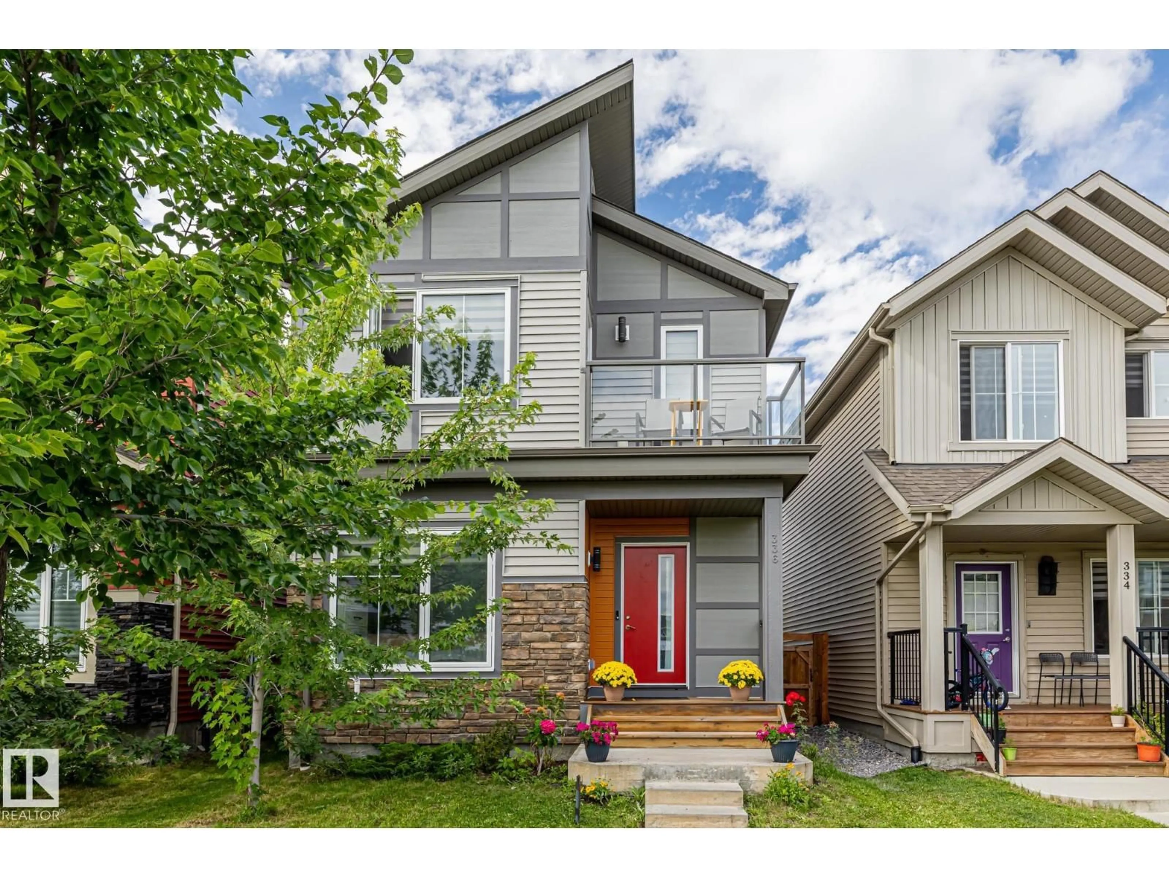 Home with vinyl exterior material, street for 336 DESROCHERS BV, Edmonton Alberta T6W3J1