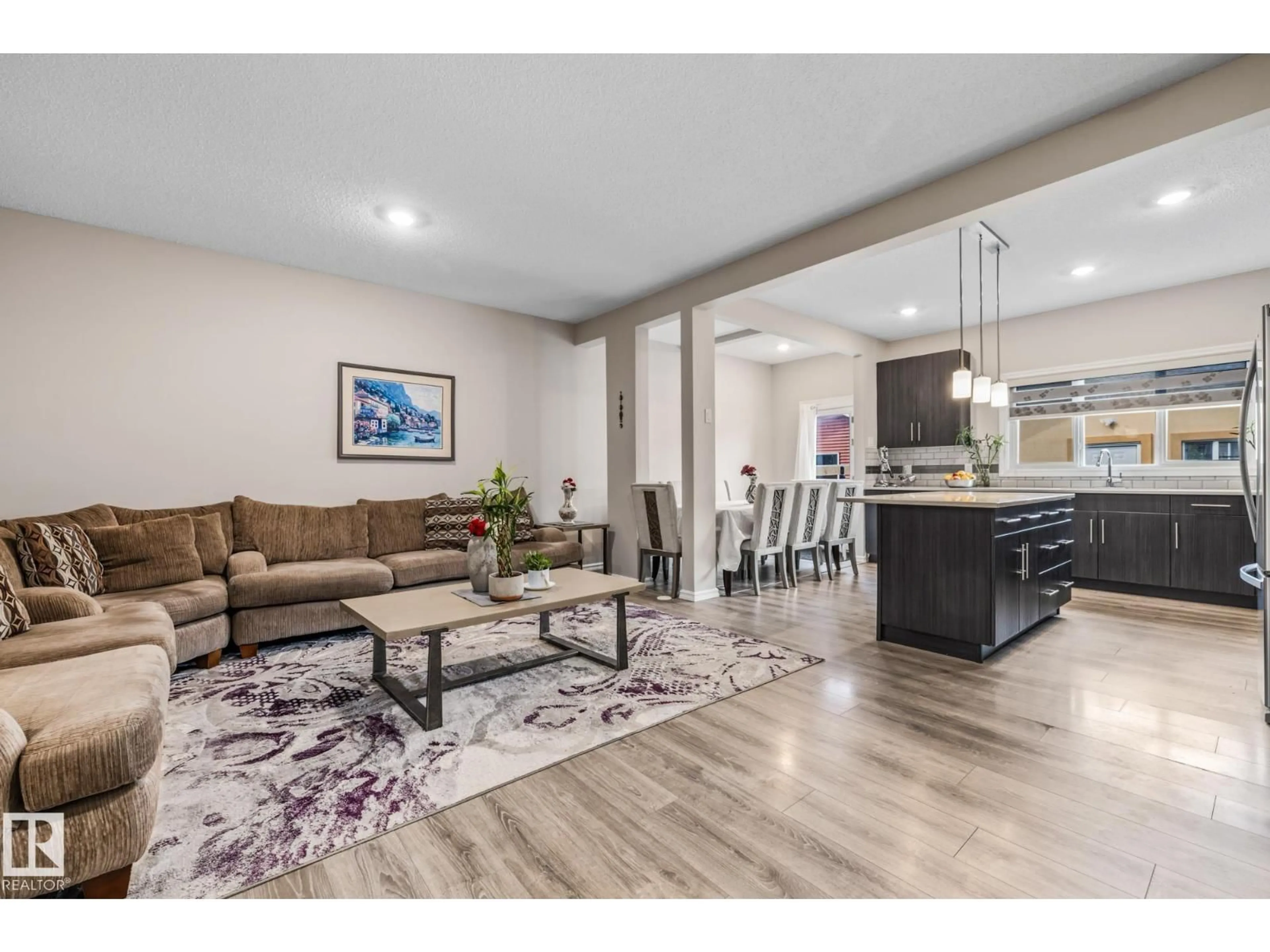 Open concept kitchen, wood/laminate floor for 336 DESROCHERS BV, Edmonton Alberta T6W3J1