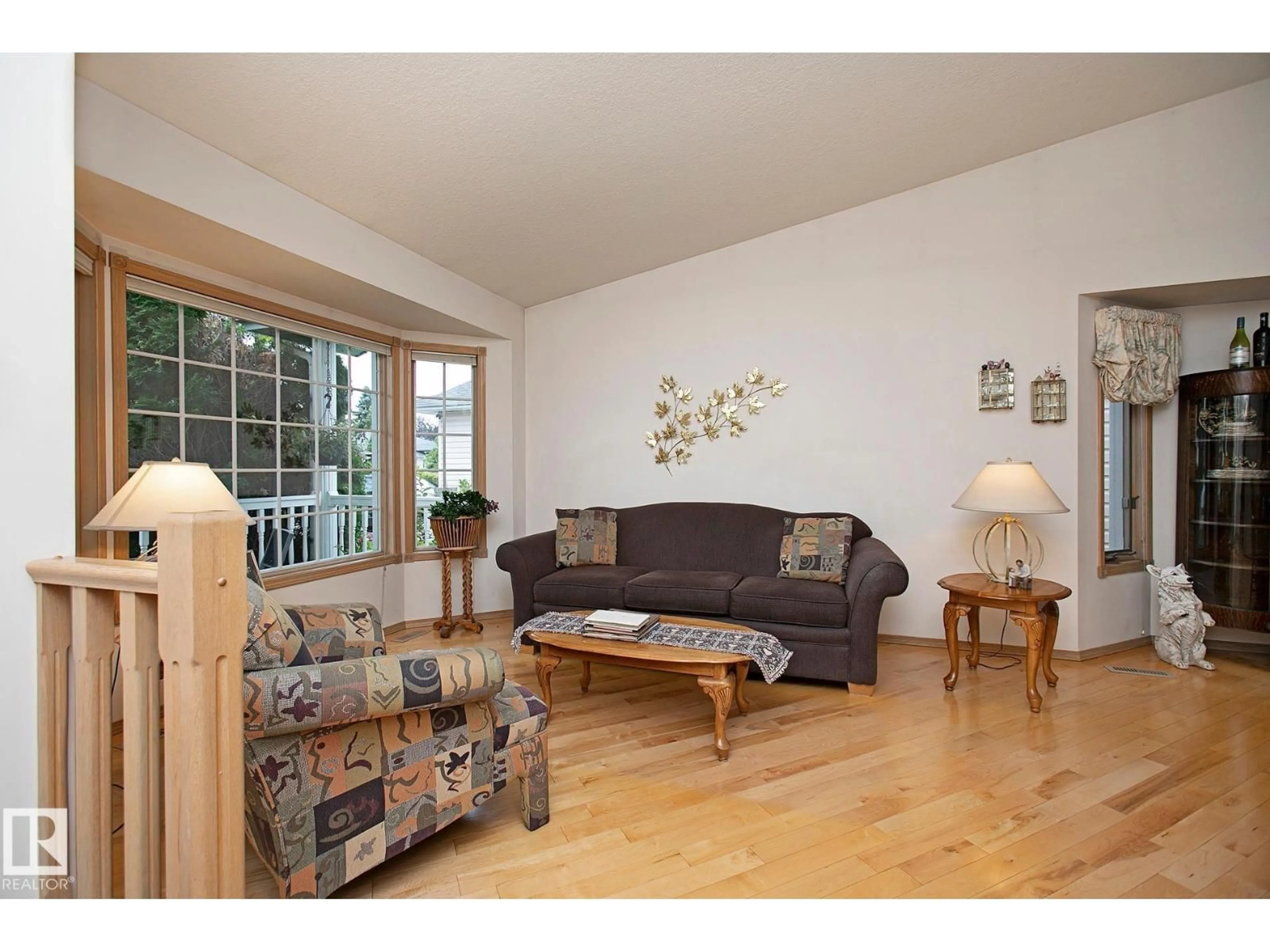 Living room with furniture, wood/laminate floor for 44 CHARLTON RD, Sherwood Park Alberta T8H1P9