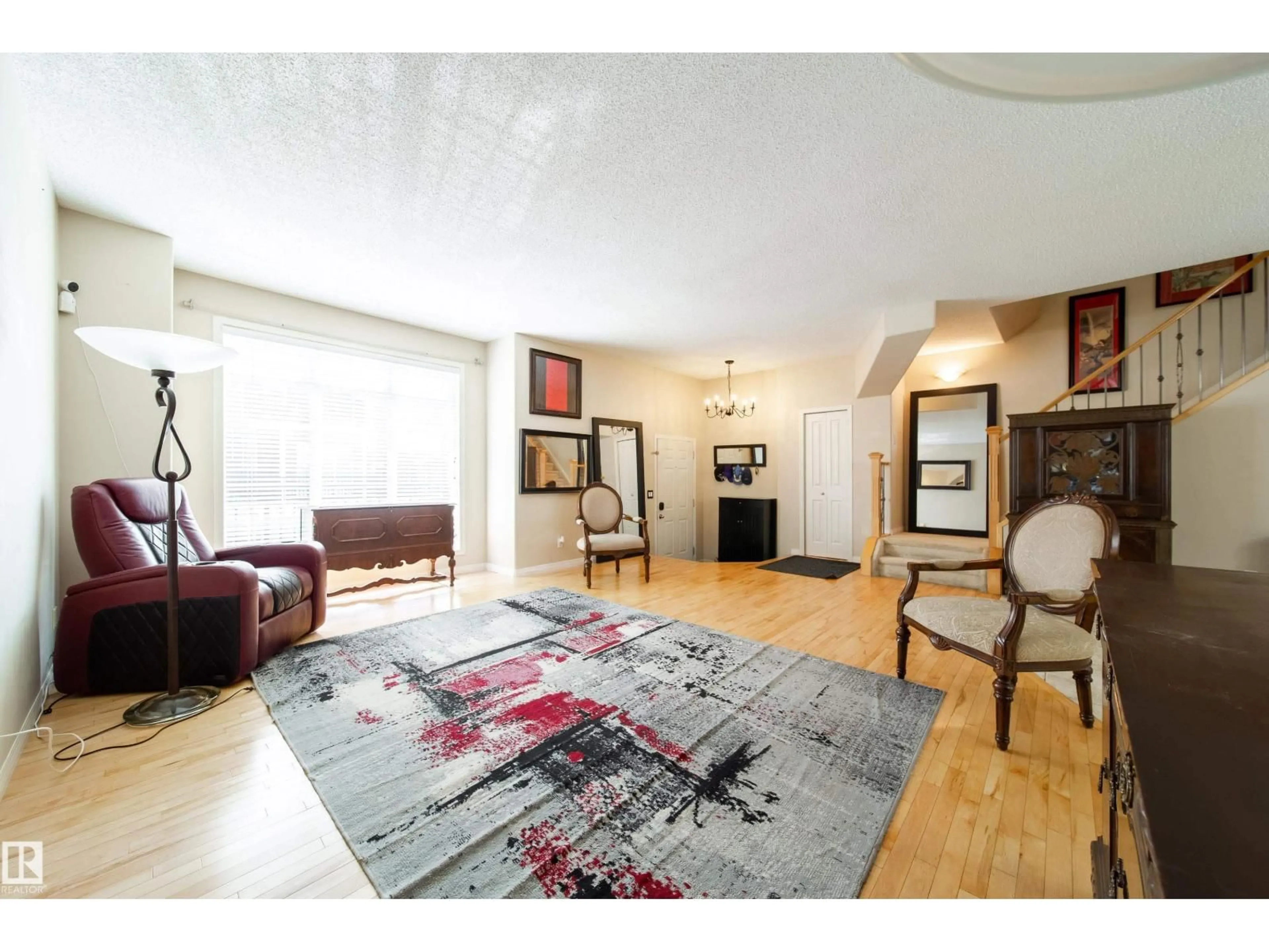 Living room with furniture, wood/laminate floor for 8403 164 AV, Edmonton Alberta T5Z3Y2