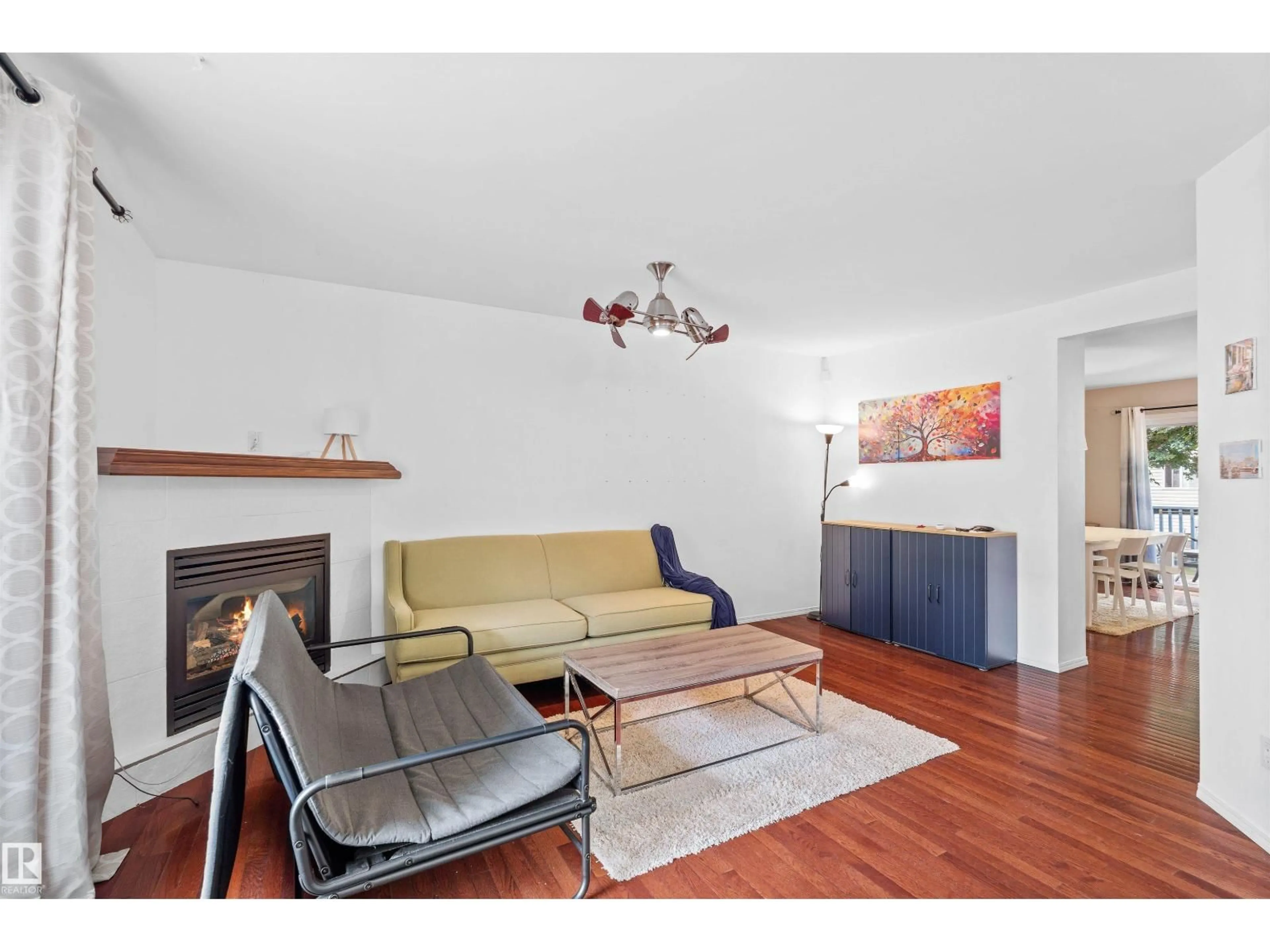 Living room with furniture, wood/laminate floor for 10516 108 AV, Edmonton Alberta T5H4M8