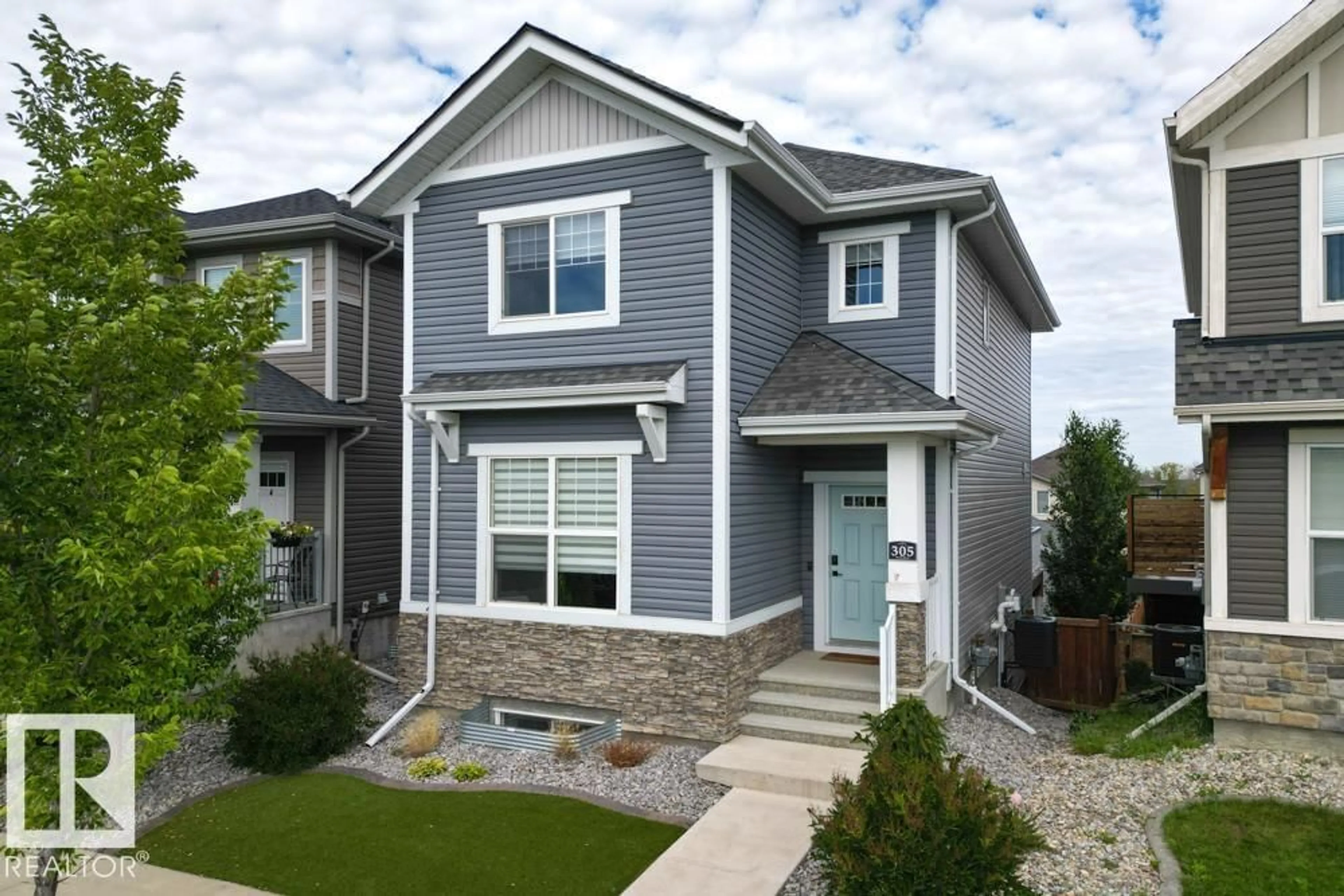 Home with vinyl exterior material, street for 305 HAWKS RIDGE BV, Edmonton Alberta T5S0M5