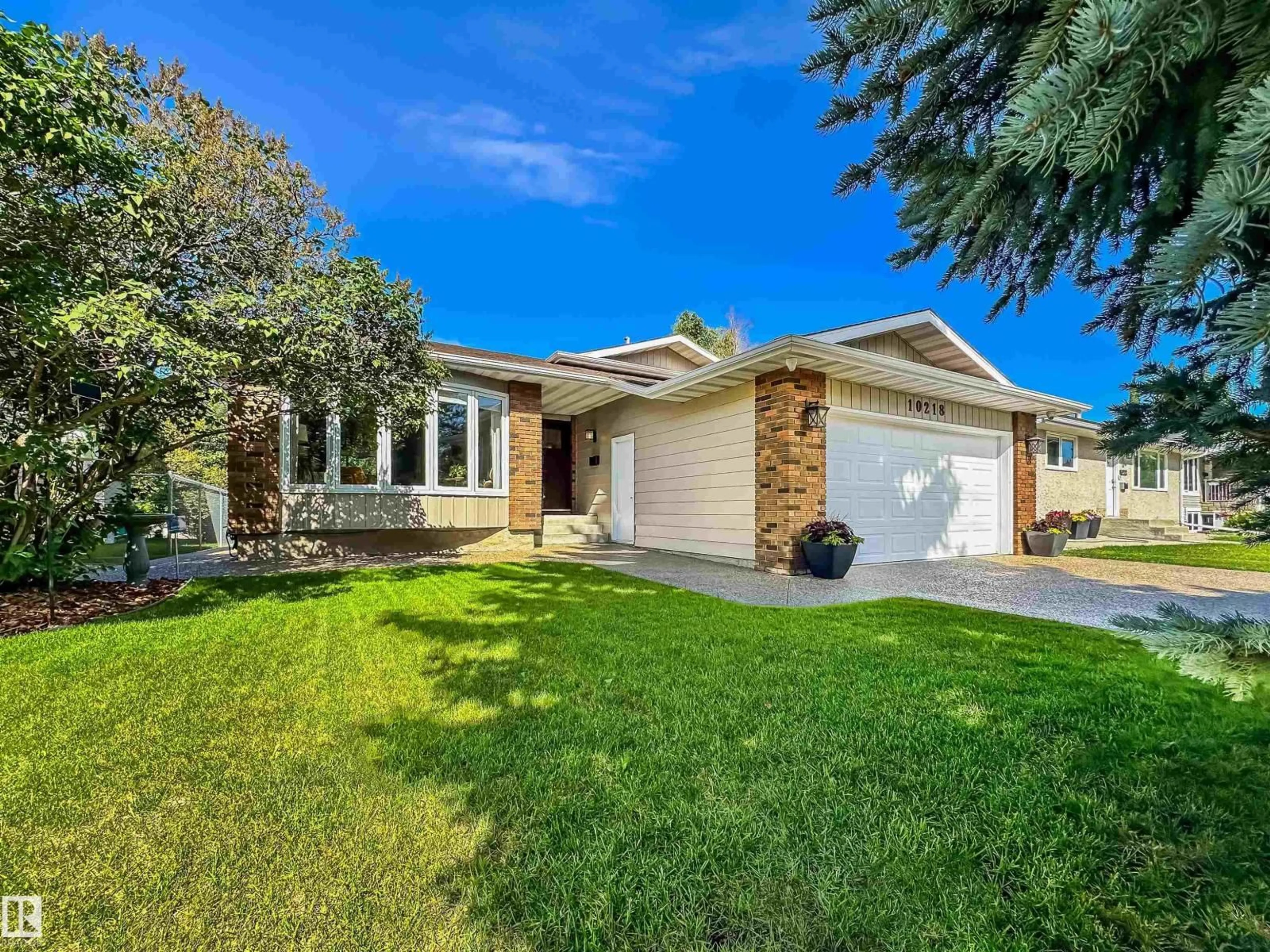 Home with vinyl exterior material, street for NW - 10218 73 ST, Edmonton Alberta T6A2X1