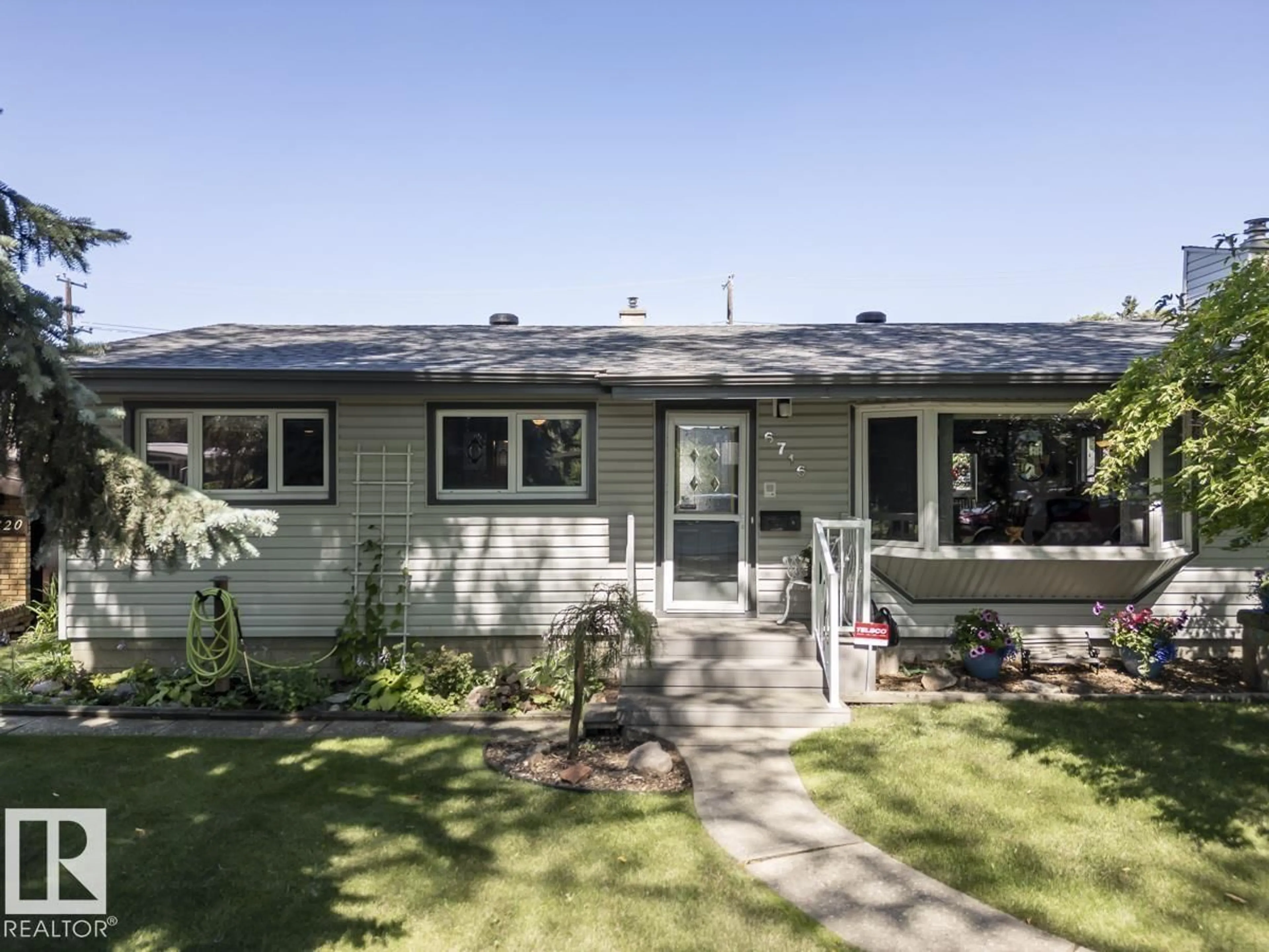 Home with vinyl exterior material, street for 6716 101A AV, Edmonton Alberta T6A0M2