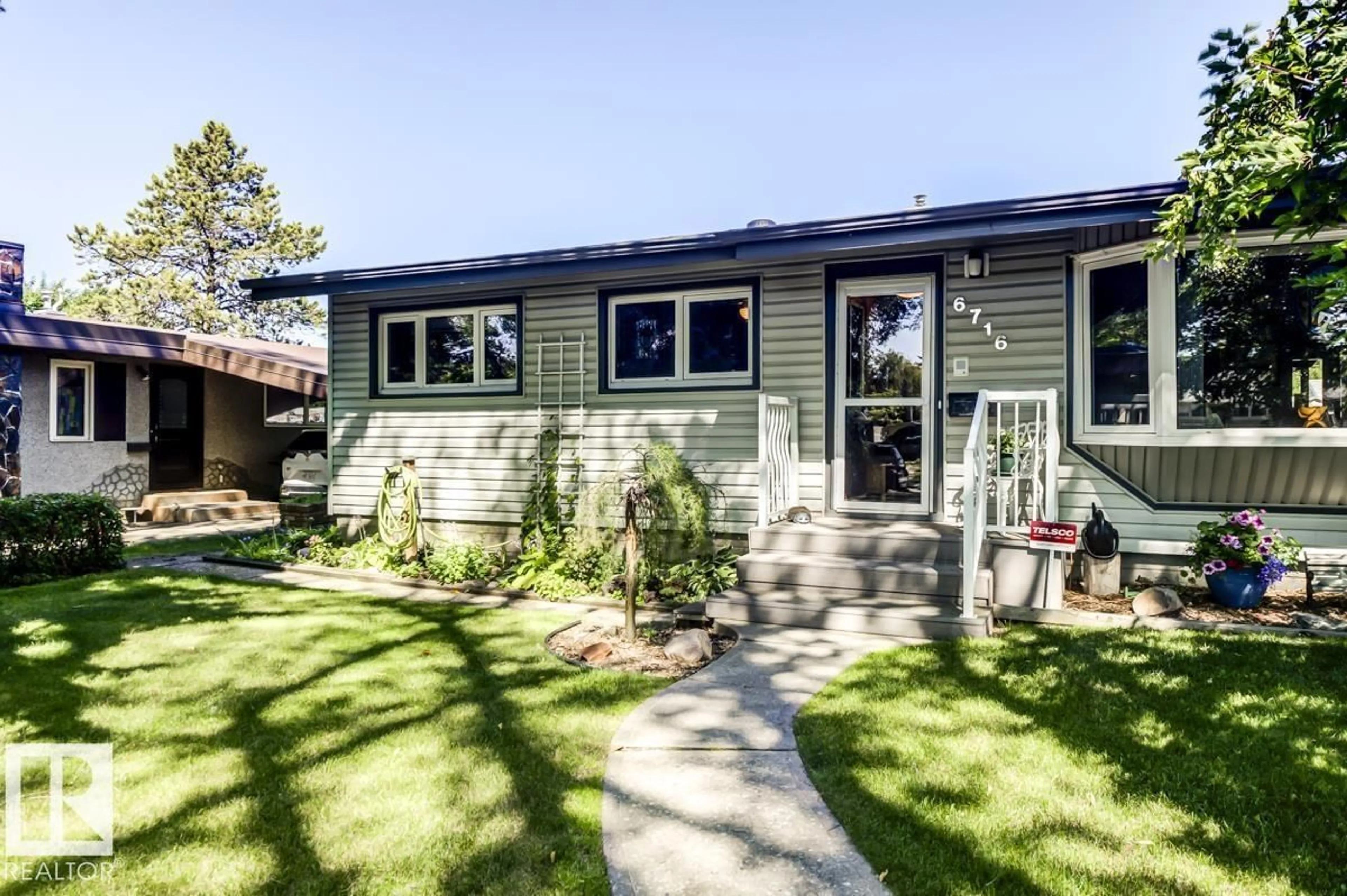 Home with vinyl exterior material, street for 6716 101A AV, Edmonton Alberta T6A0M2