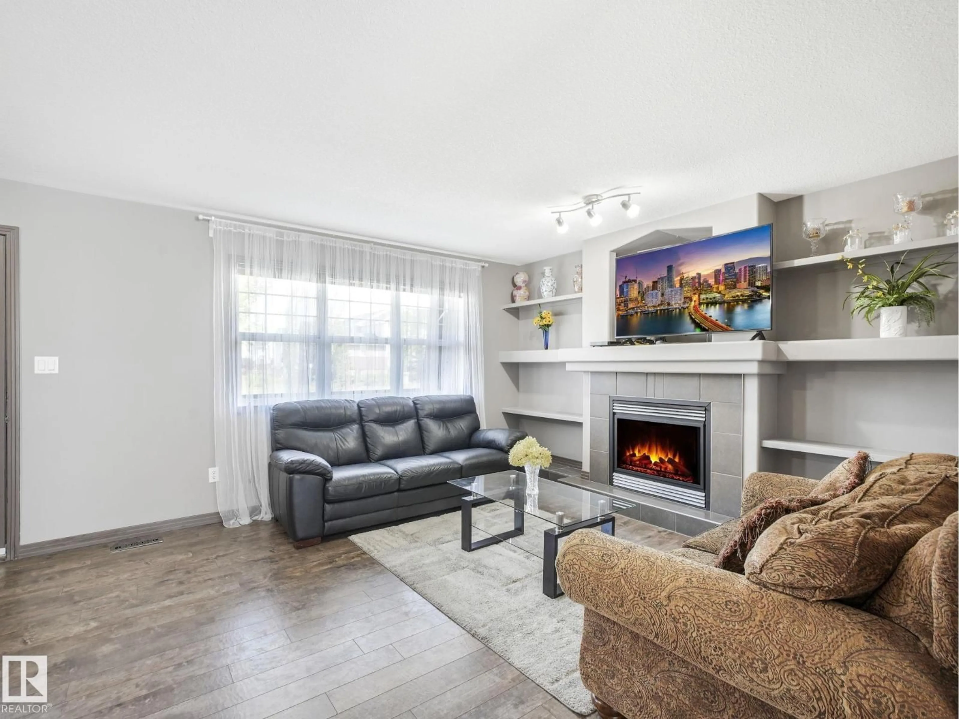 Living room with furniture, wood/laminate floor for 2353 ASPEN TR, Sherwood Park Alberta T8H0G3