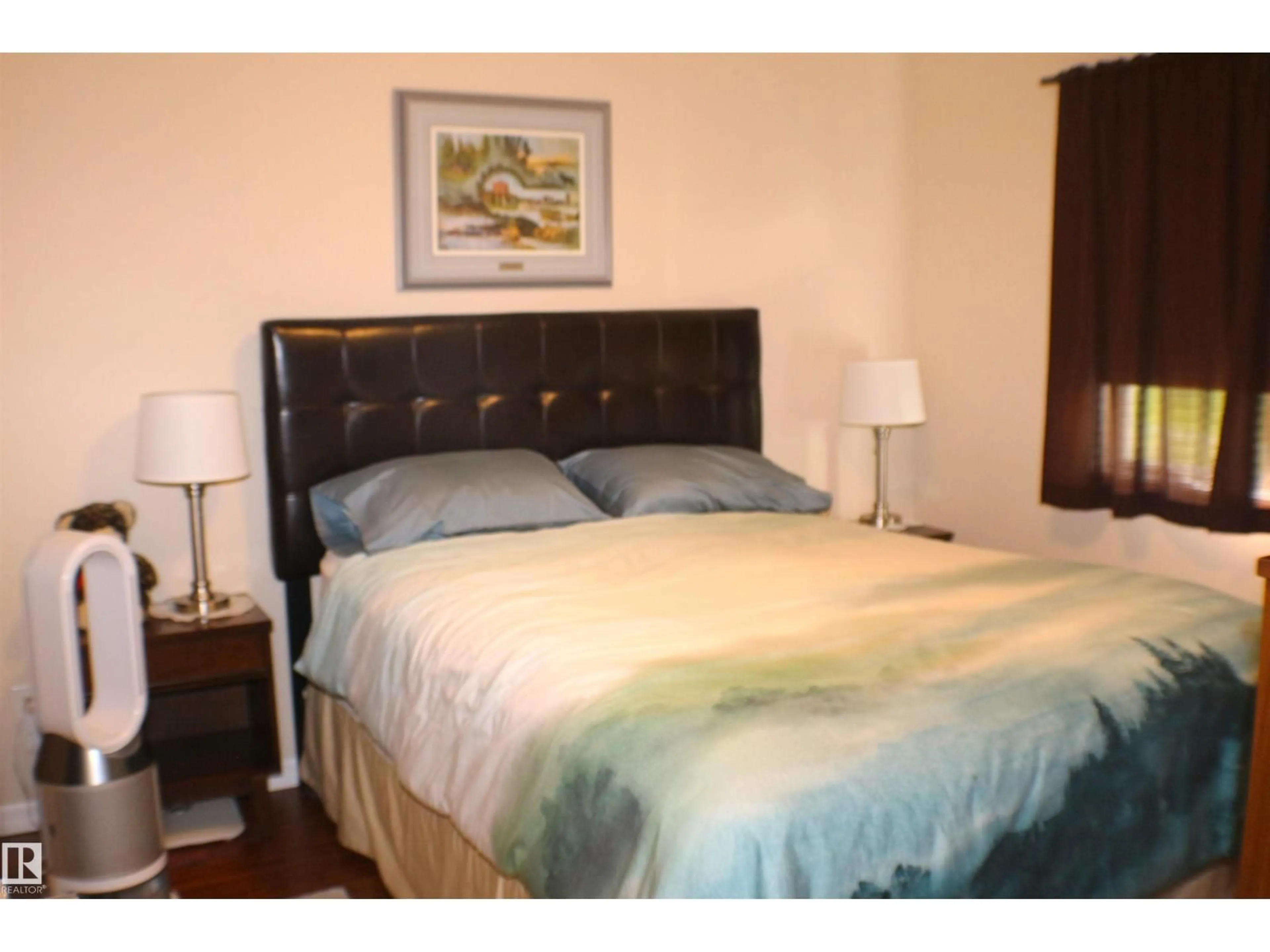 Bedroom with bed, wood/laminate floor for #209 - 271 CHARLOTTE WY, Sherwood Park Alberta T8H0N9