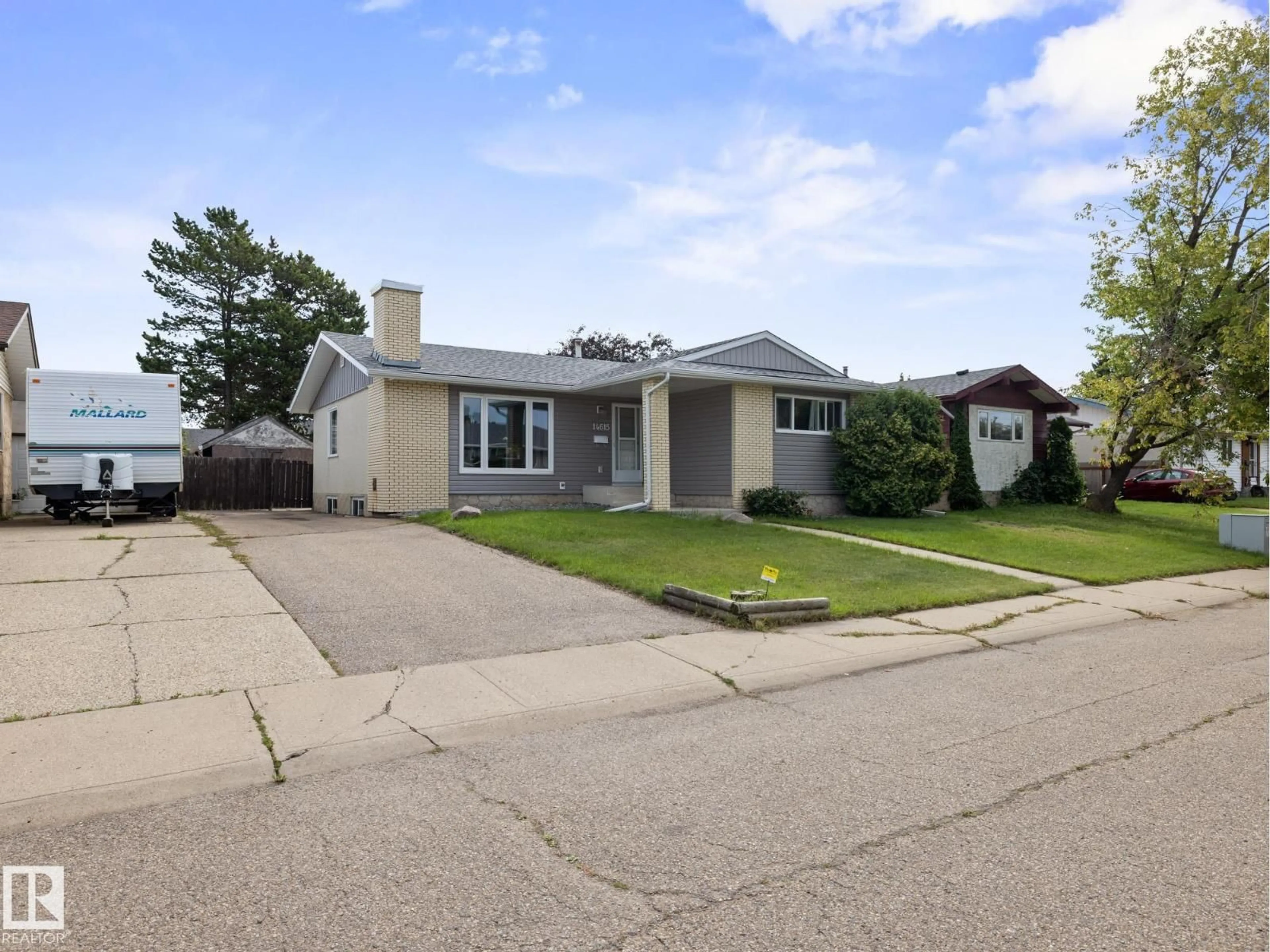 Home with vinyl exterior material, street for 14615 116 ST NW, Edmonton Alberta T5X1J4