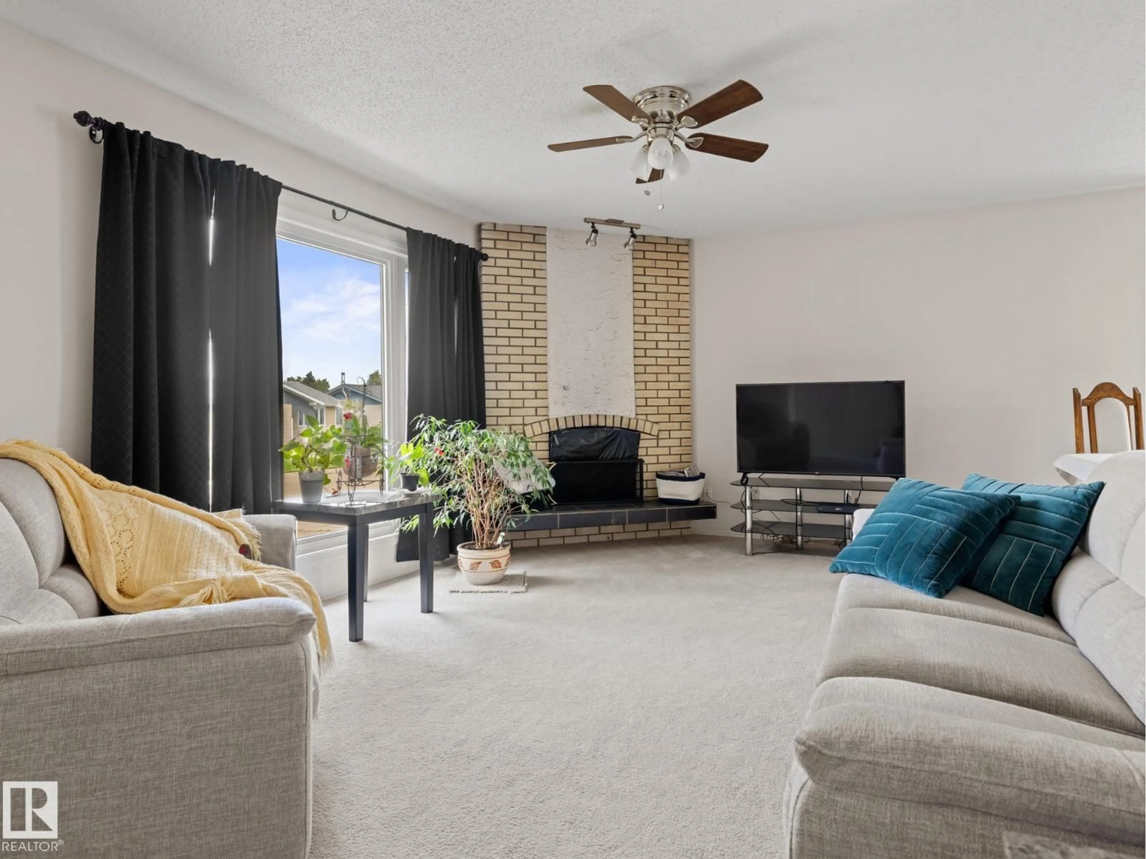 Living room with furniture, unknown for 14615 116 ST NW, Edmonton Alberta T5X1J4